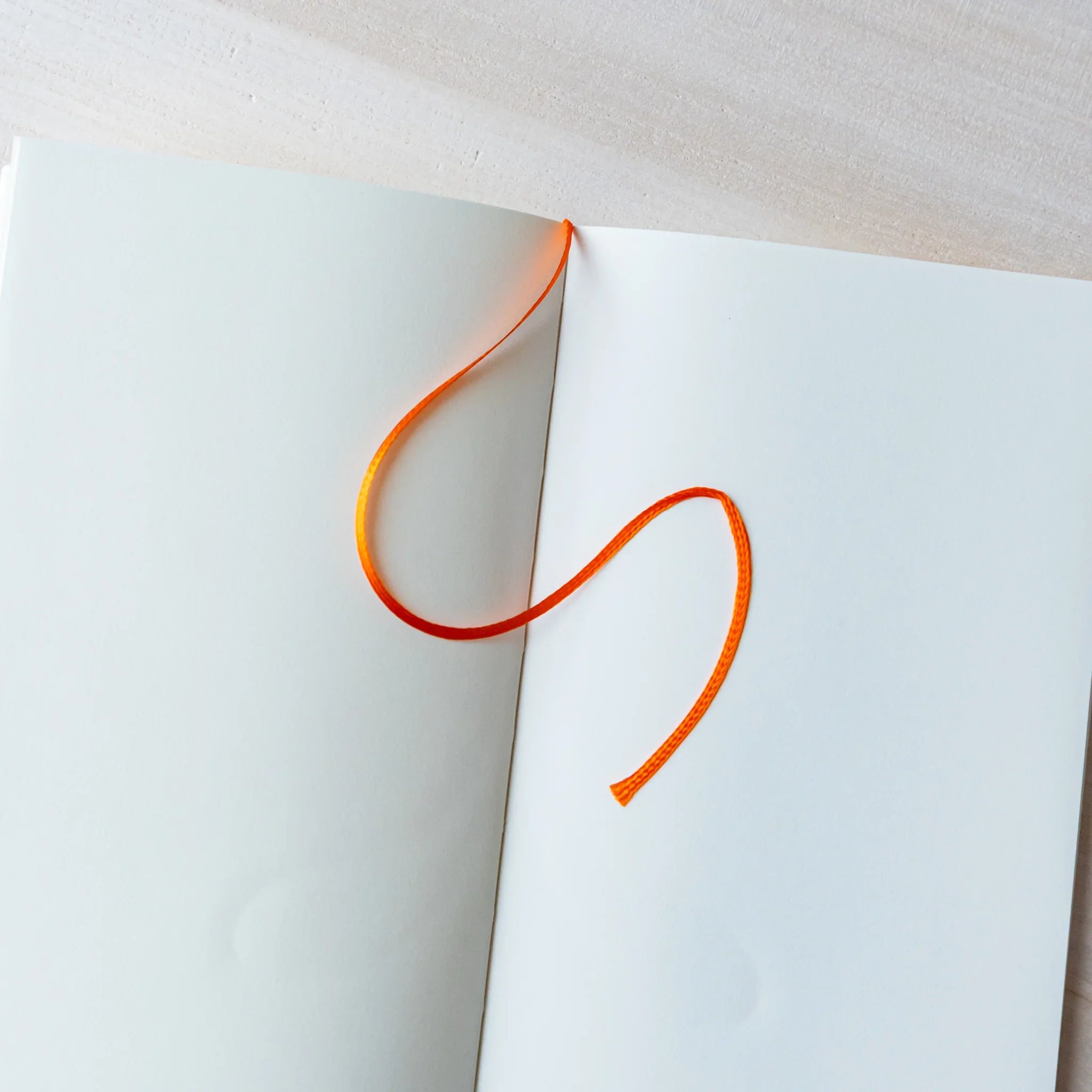 Midori MD B6 notebook, side profile showing B6 size and binding, Japanese MD notebook with fountain pen-friendly cream paper