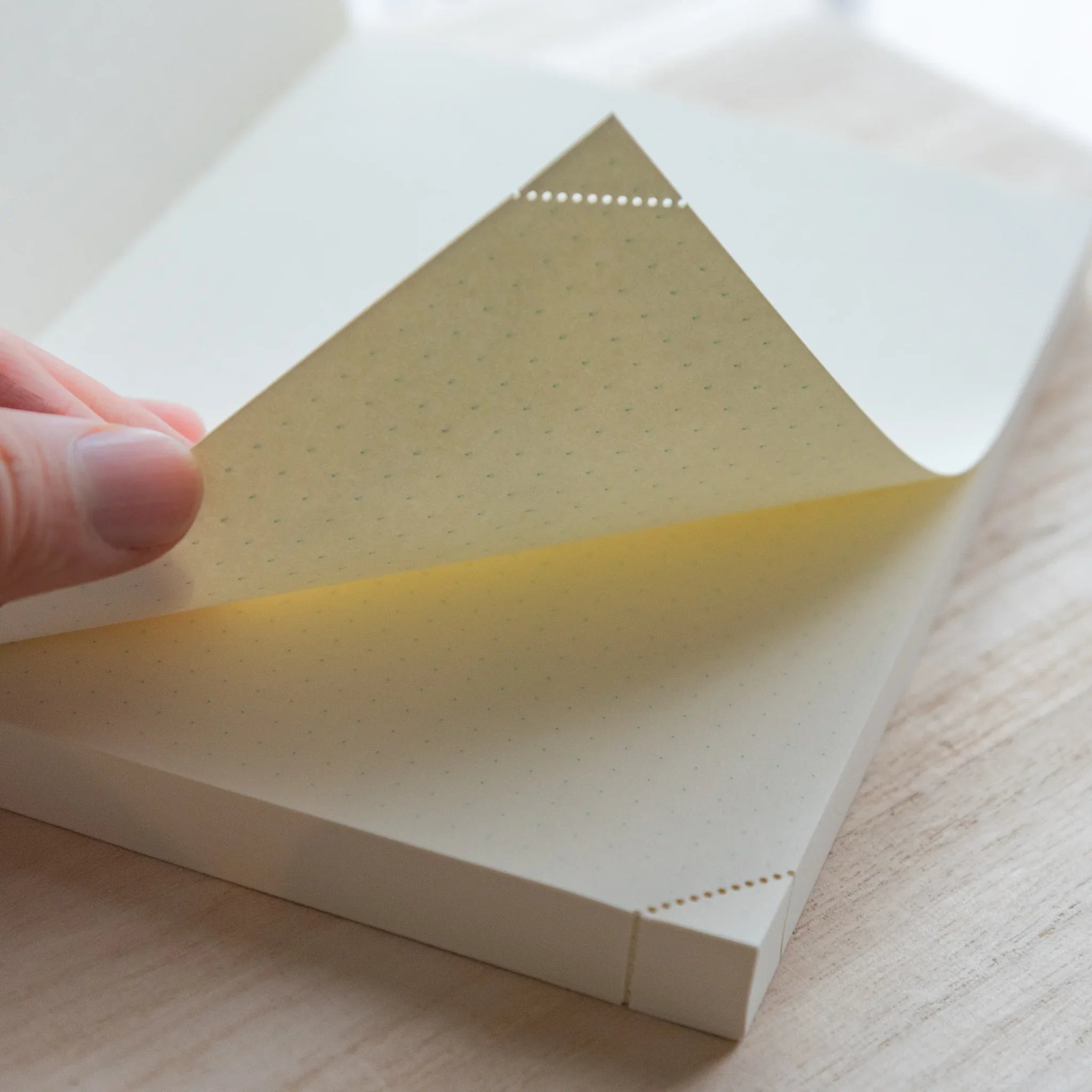 Midori MD A5 journal, angled view displaying open pages and cover, Japanese Midori MD notebook with cotton-smooth paper and