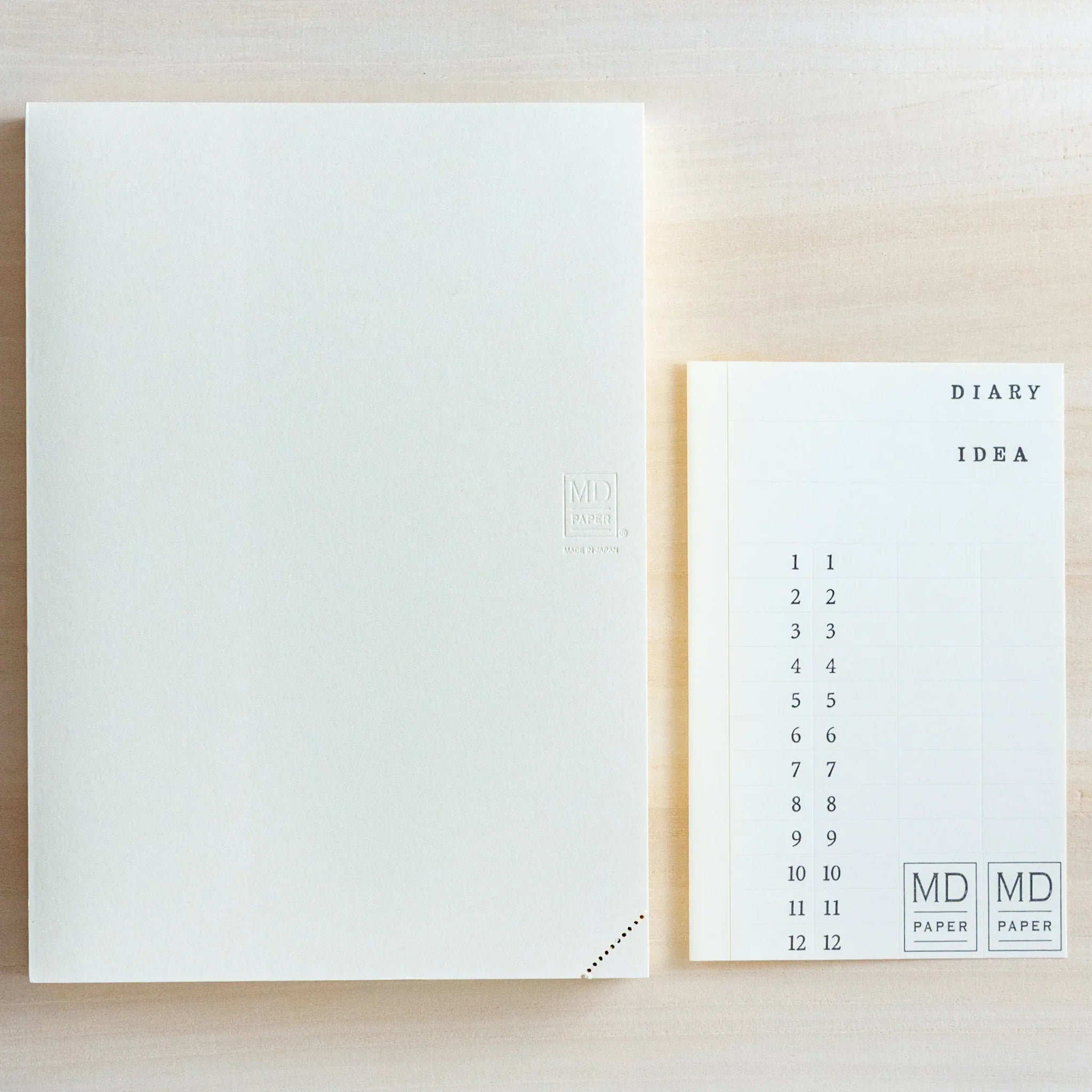 Midori MD A5 journal, side profile showing A5 size binding and cover detail, Japanese MD notebook with fountain pen-friendly