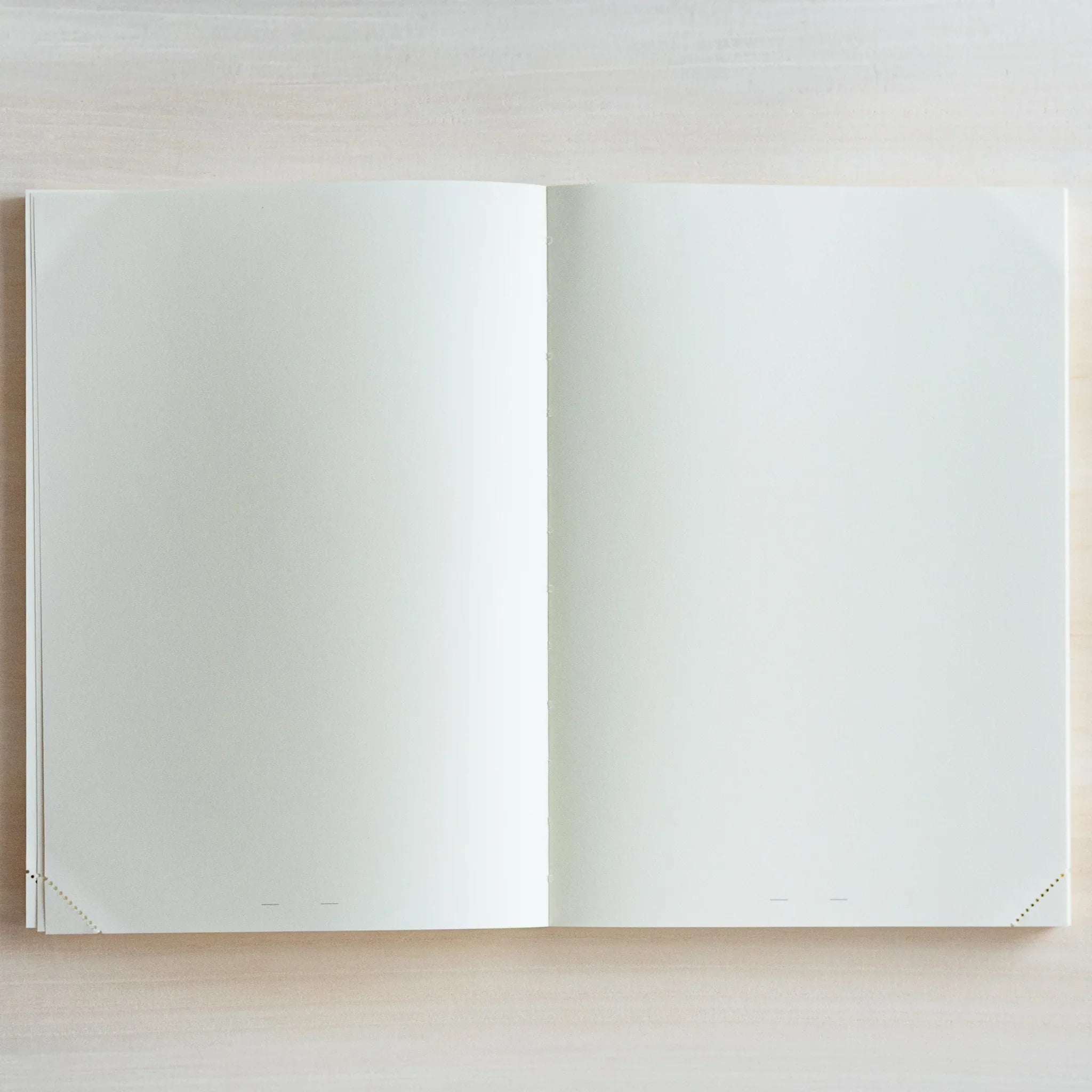 Top view of open Midori Japanese journal showing blank double-page.