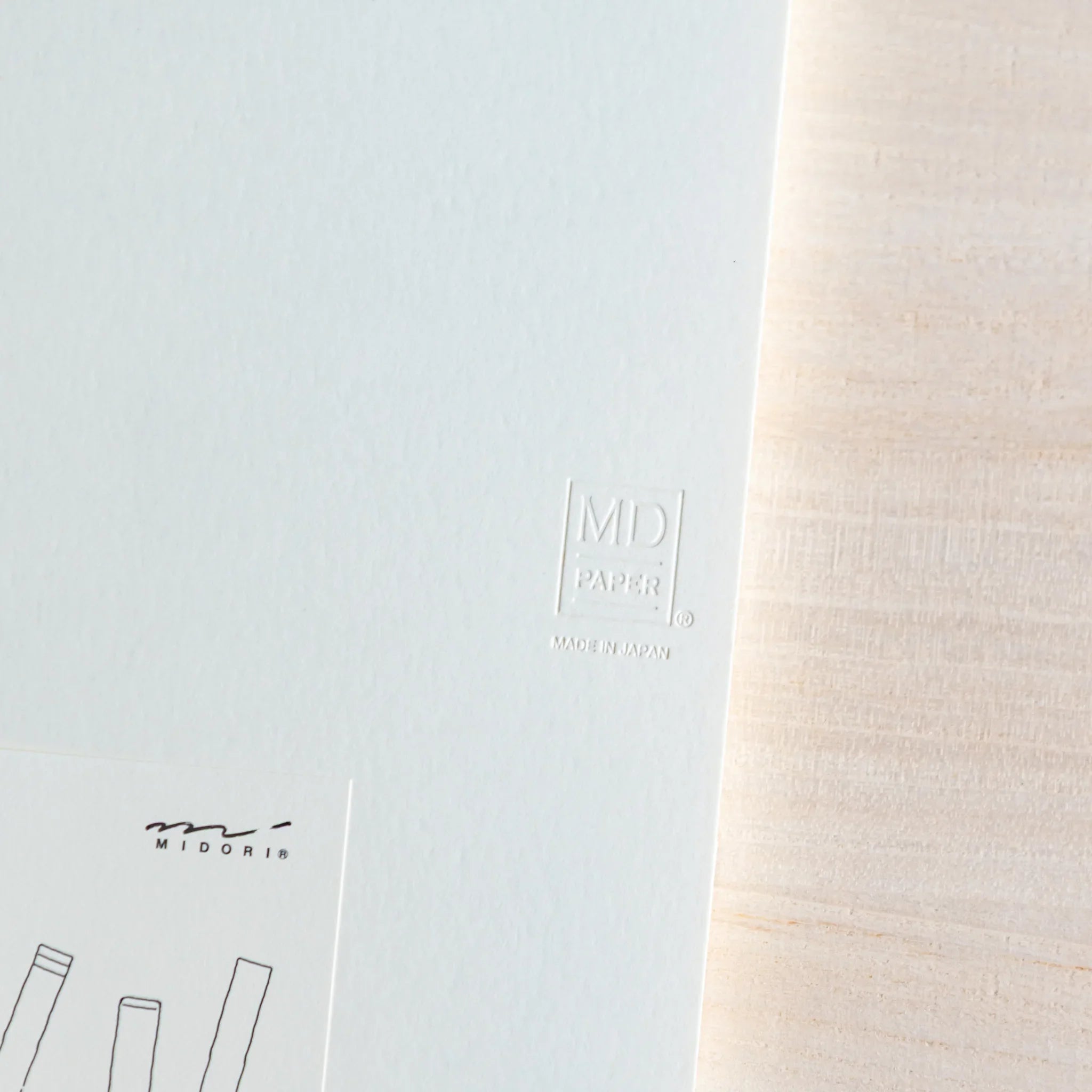 Midori MD A5 blank notebook, angled view showing open blank pages, Japanese Midori MD notebook with cotton-smooth paper and