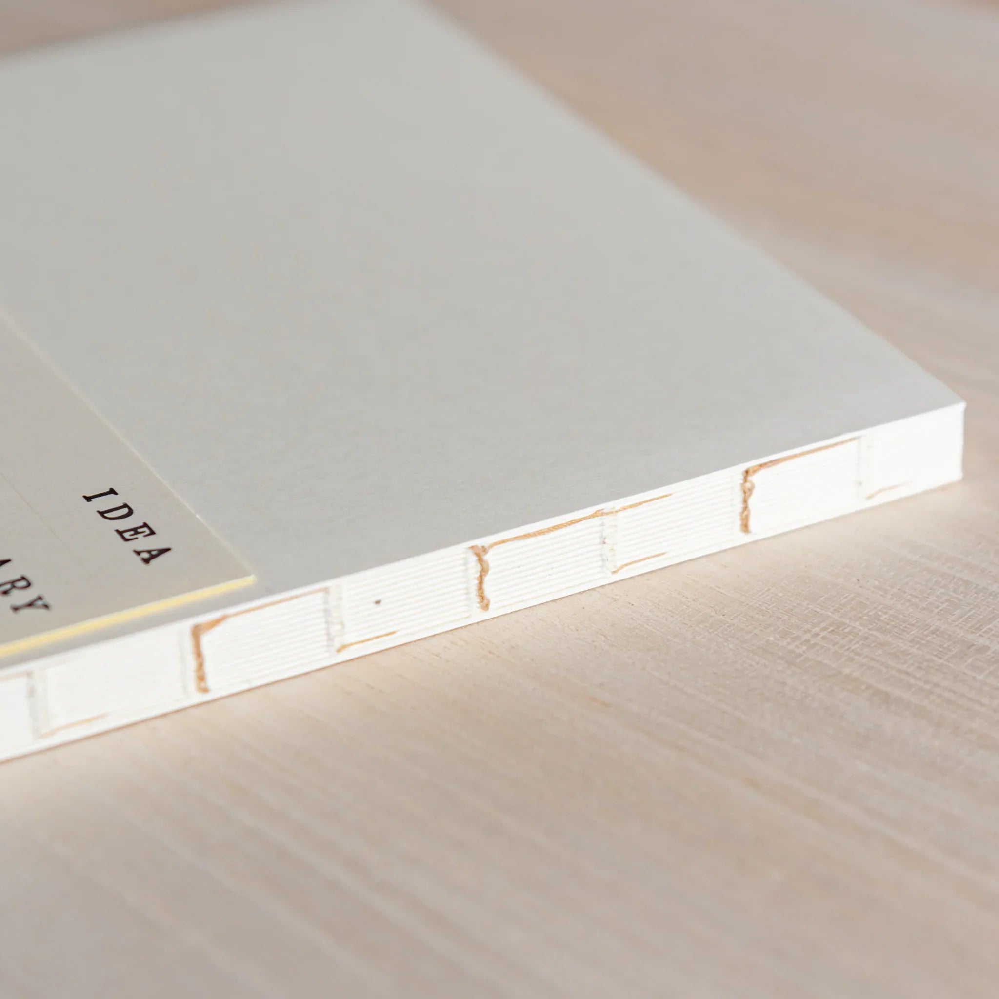 Midori MD A5 blank notebook, flat lay of closed blank notebook cover, Midori MD paper journal with long-write comfort and