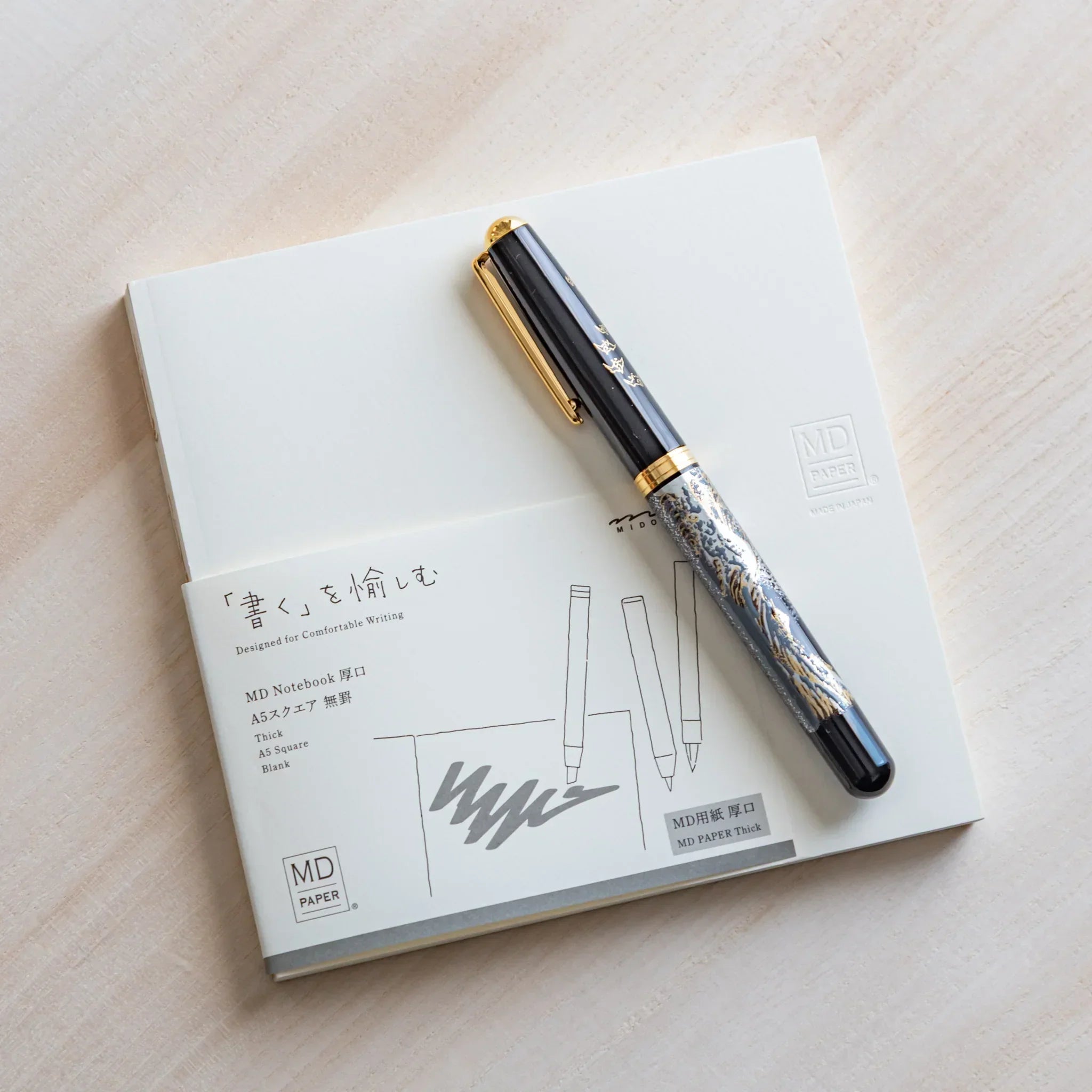 Midori MD A5 square grid notebook, open spread with square grid pattern, MD Notebook from Midori with thick cream paper and