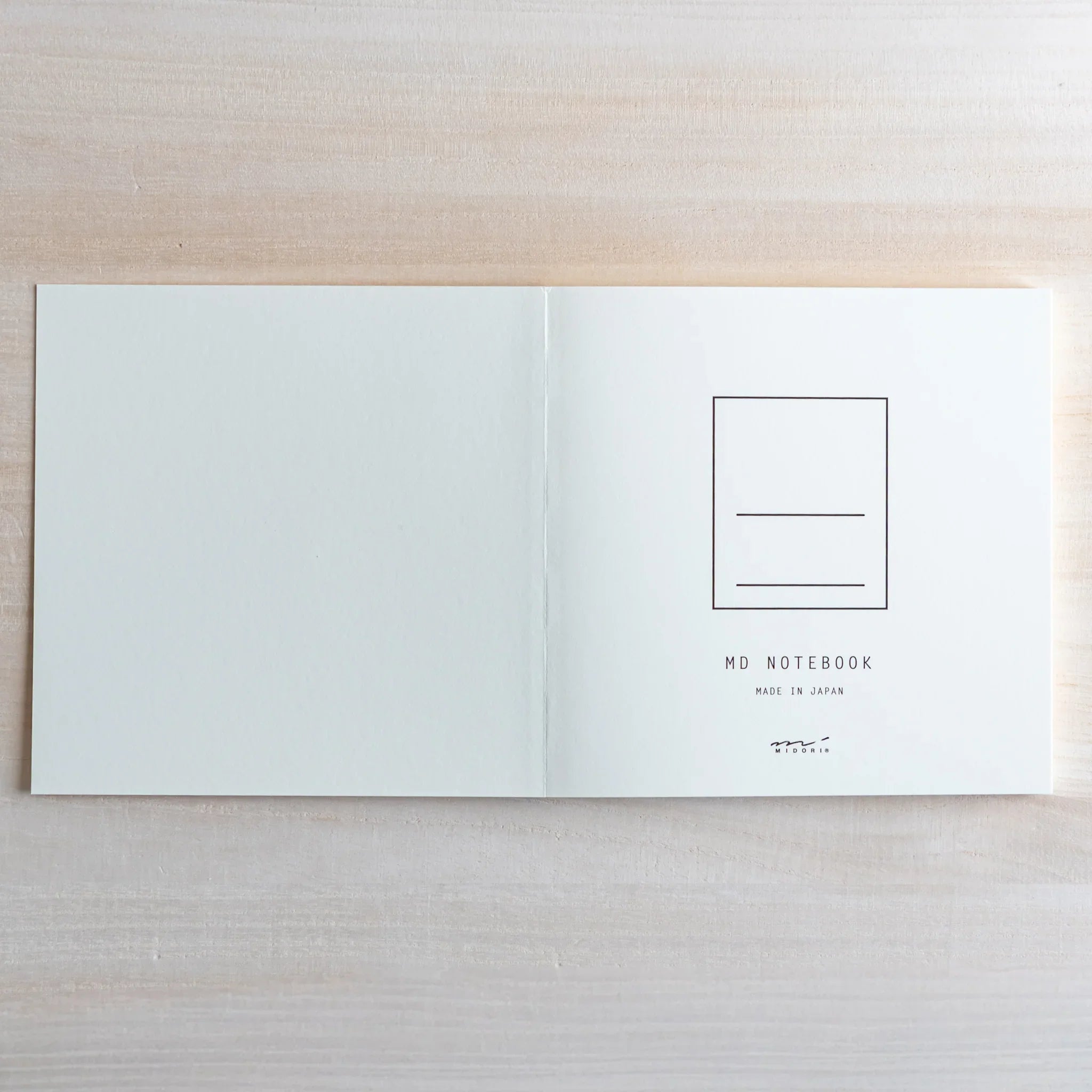 Midori MD A5 grid notebook, cover flat lay showing minimalist design, Japanese Midori MD notebook with cotton-smooth paper