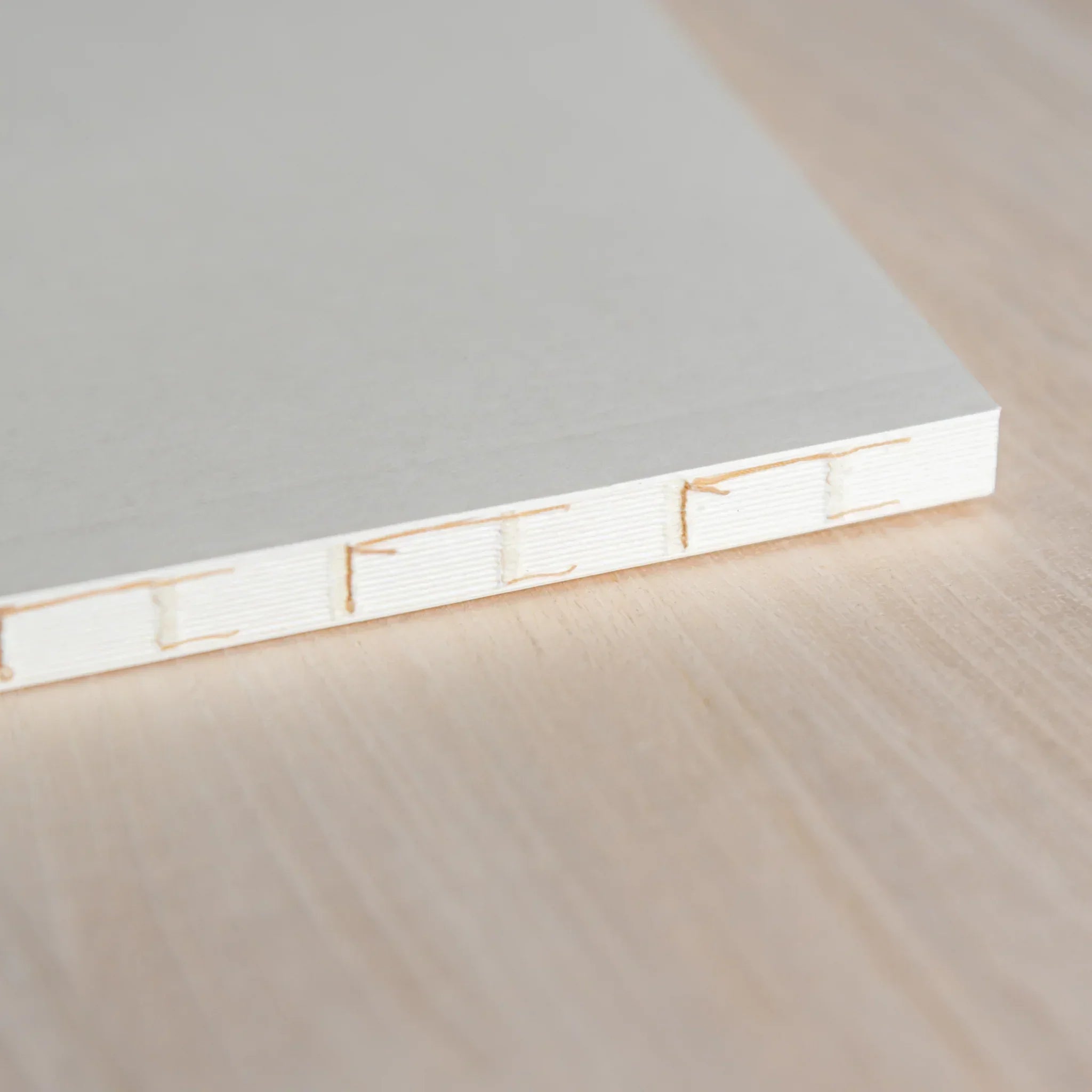 Midori MD A5 square grid notebook, flat lay of closed grid notebook cover, Midori MD paper journal with long-write comfort