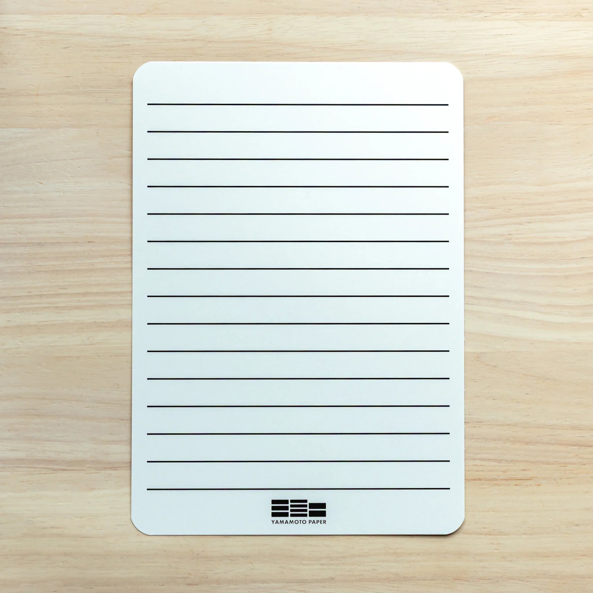 Tomoe River paper pad showing opened pages with fine high quality paper texture detail clearly visible