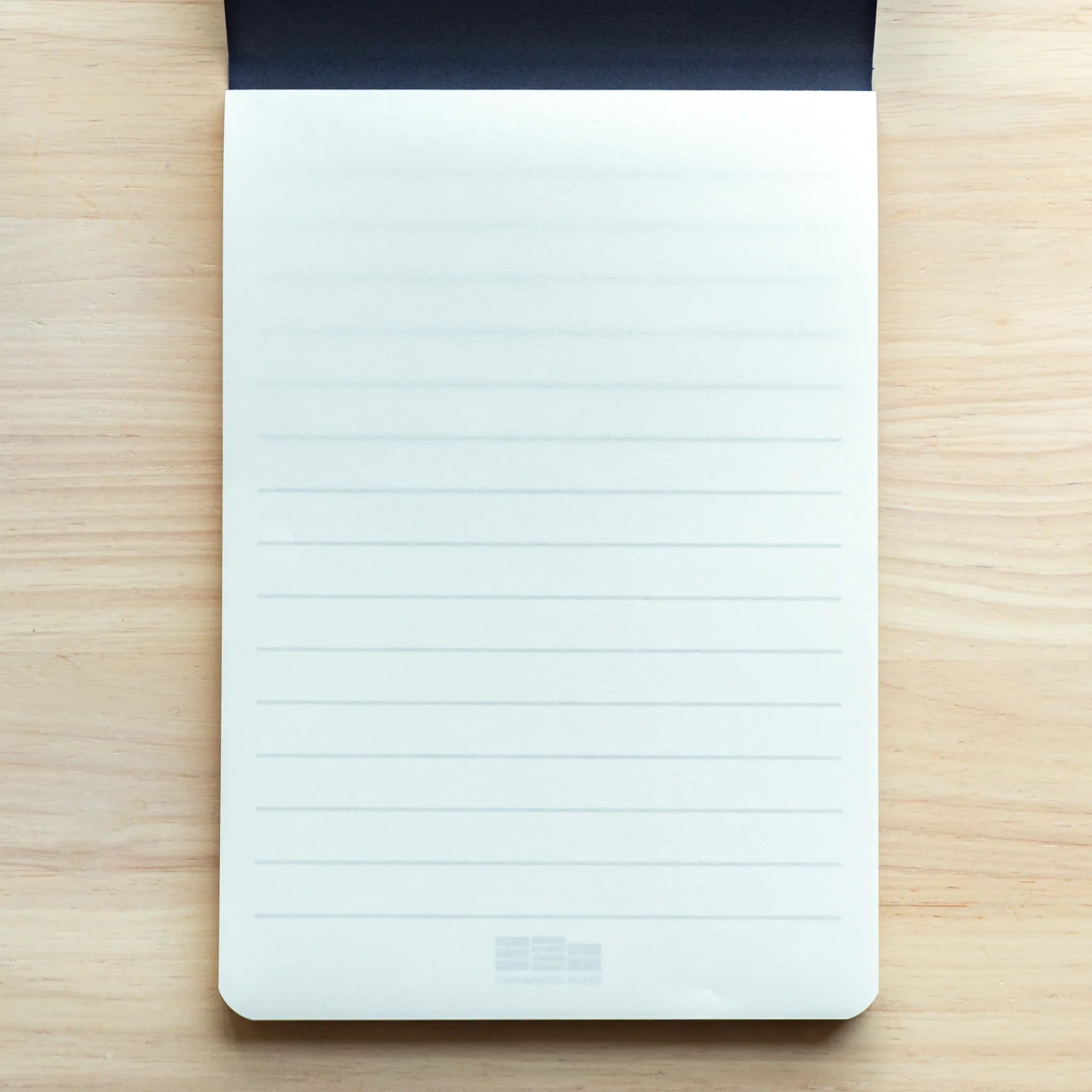 Single page from Mitsubishi Bank Ledger pad displaying horizontal lines and blank writing space for notes