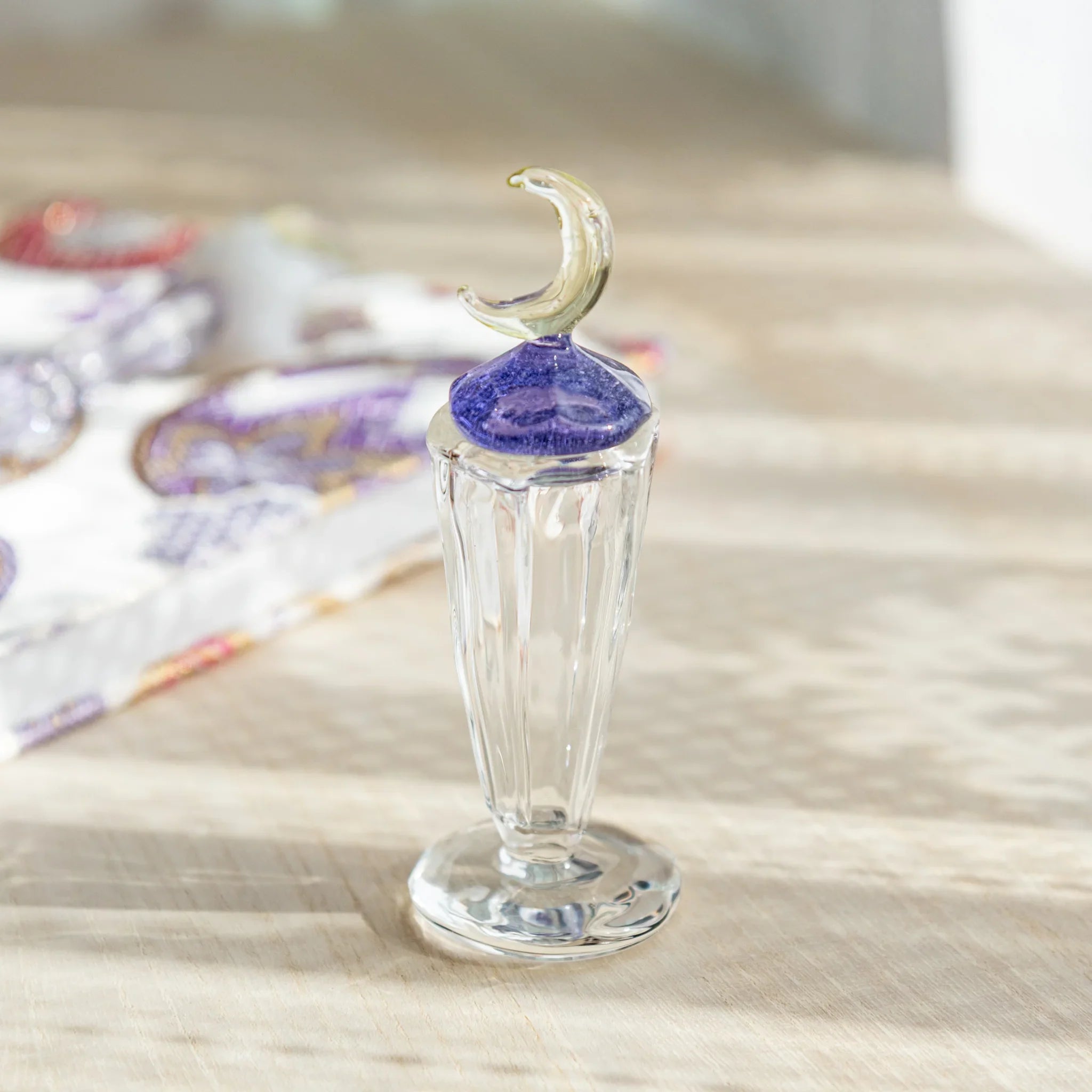 Moonlit Glass Ink Well, a handcrafted Japanese glass ink well with a crescent moon lid and shimmering purple details.
