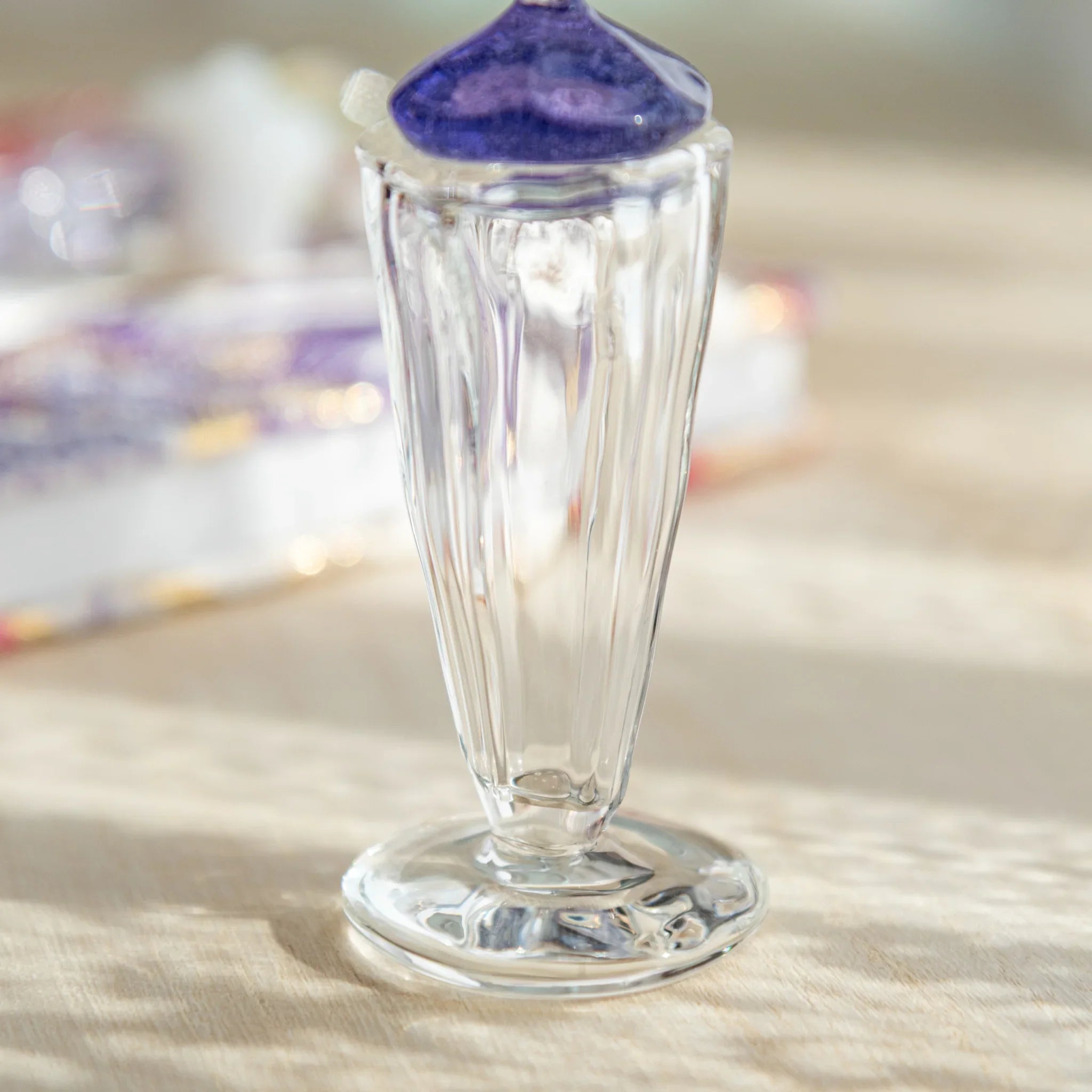 Japanese glass ink well with crescent moon lid, crafted for calligraphy and fountain pen writing, adding elegance to your desk.