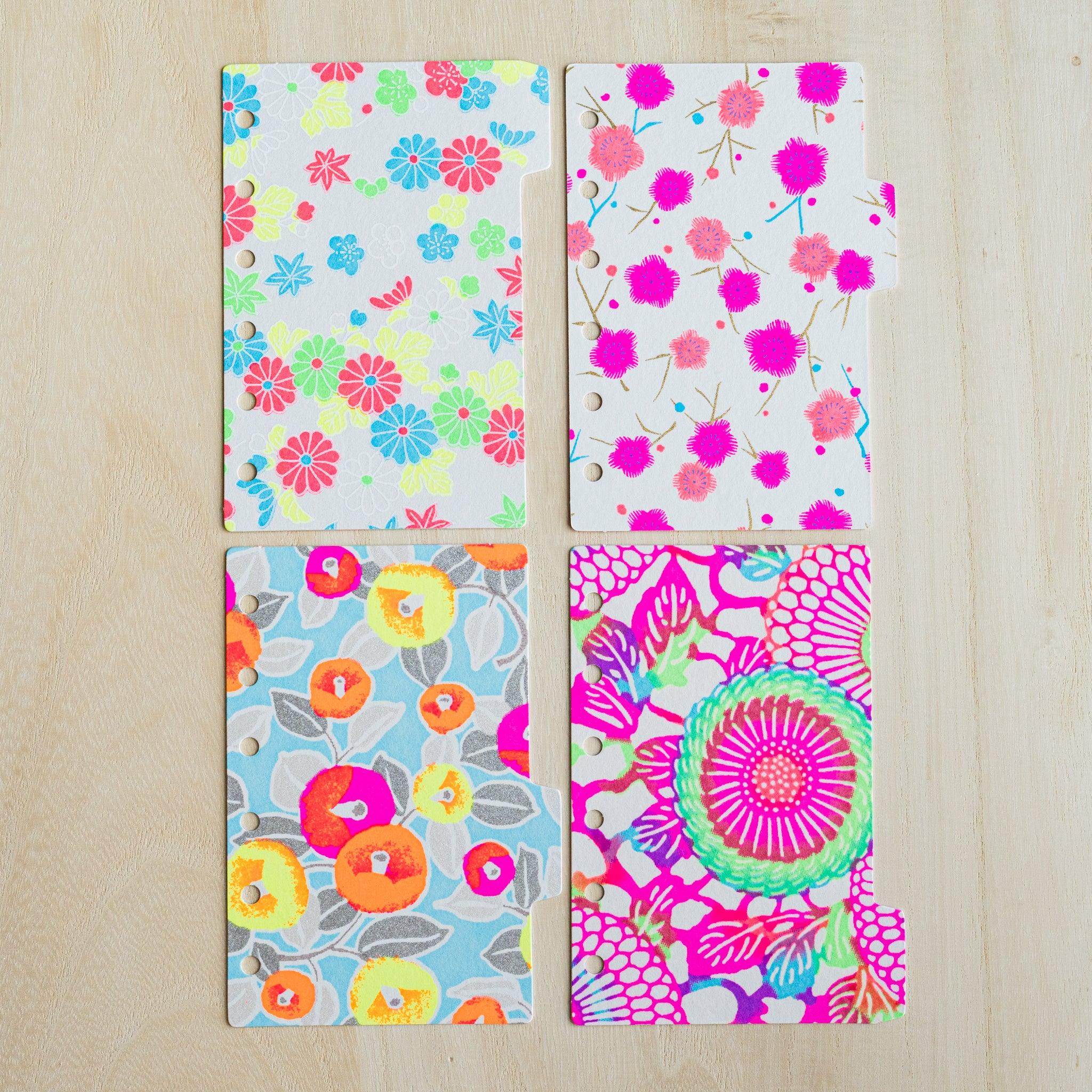 Four neon Mini 6 index dividers laid in a grid, multicolor flower, magenta plum, camellia and chrysanthemum prints