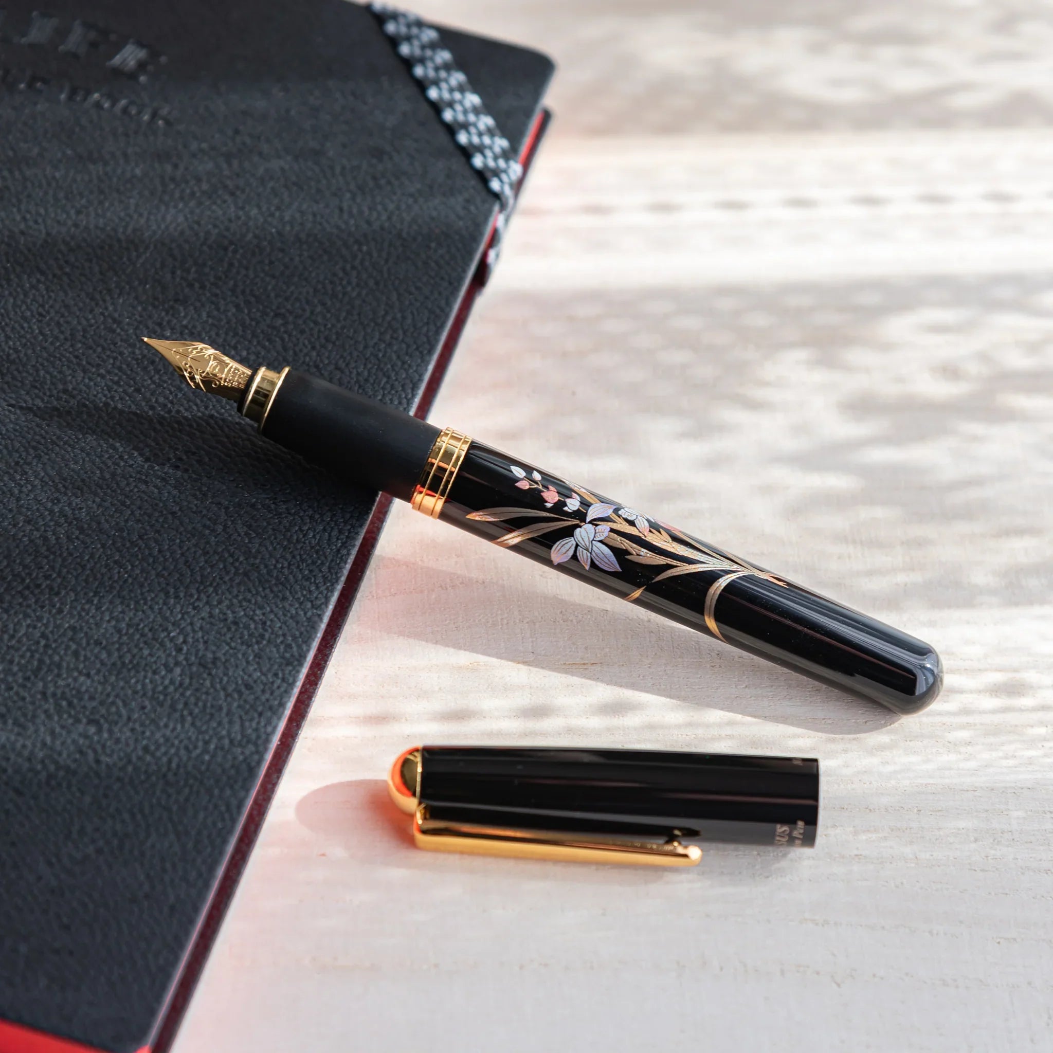 Orchid flower Yamanaka fountain pen with lacquer design shown in composition in detailed composition