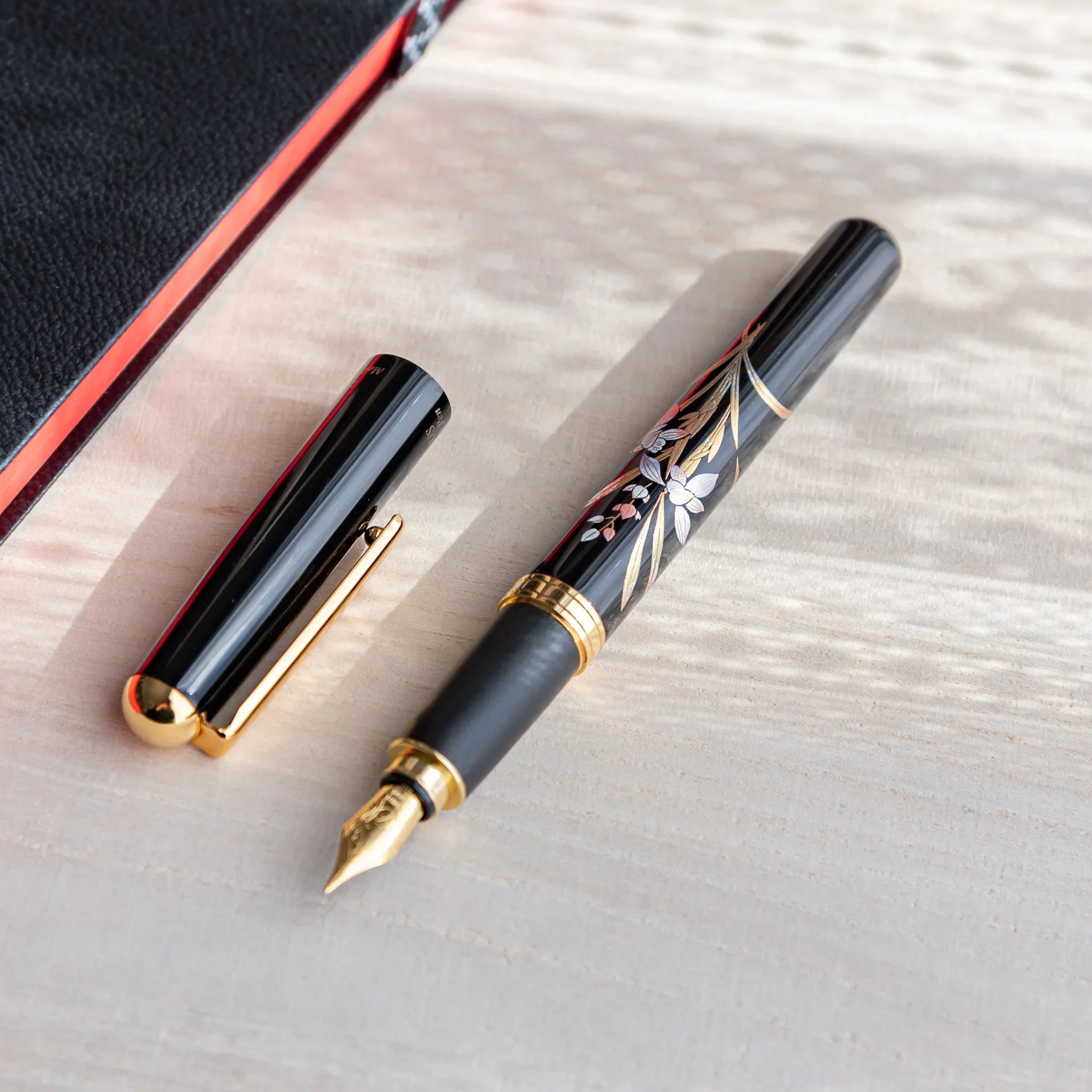 Orchid flower Yamanaka fountain pen with lacquer design shown in composition displayed in detail product composition view