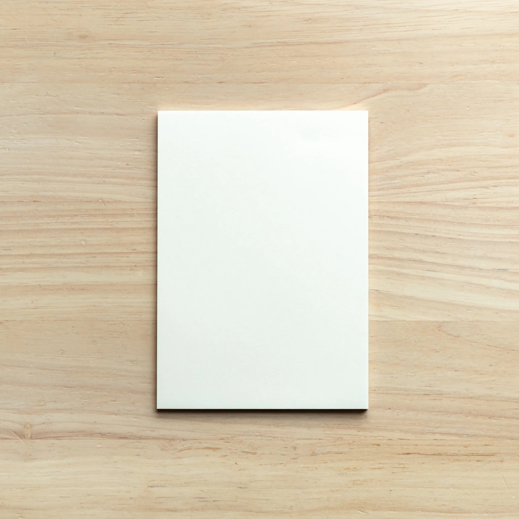 Stacked silky paper pads arranged in organized formation showcasing uniform paper finish and collection completeness