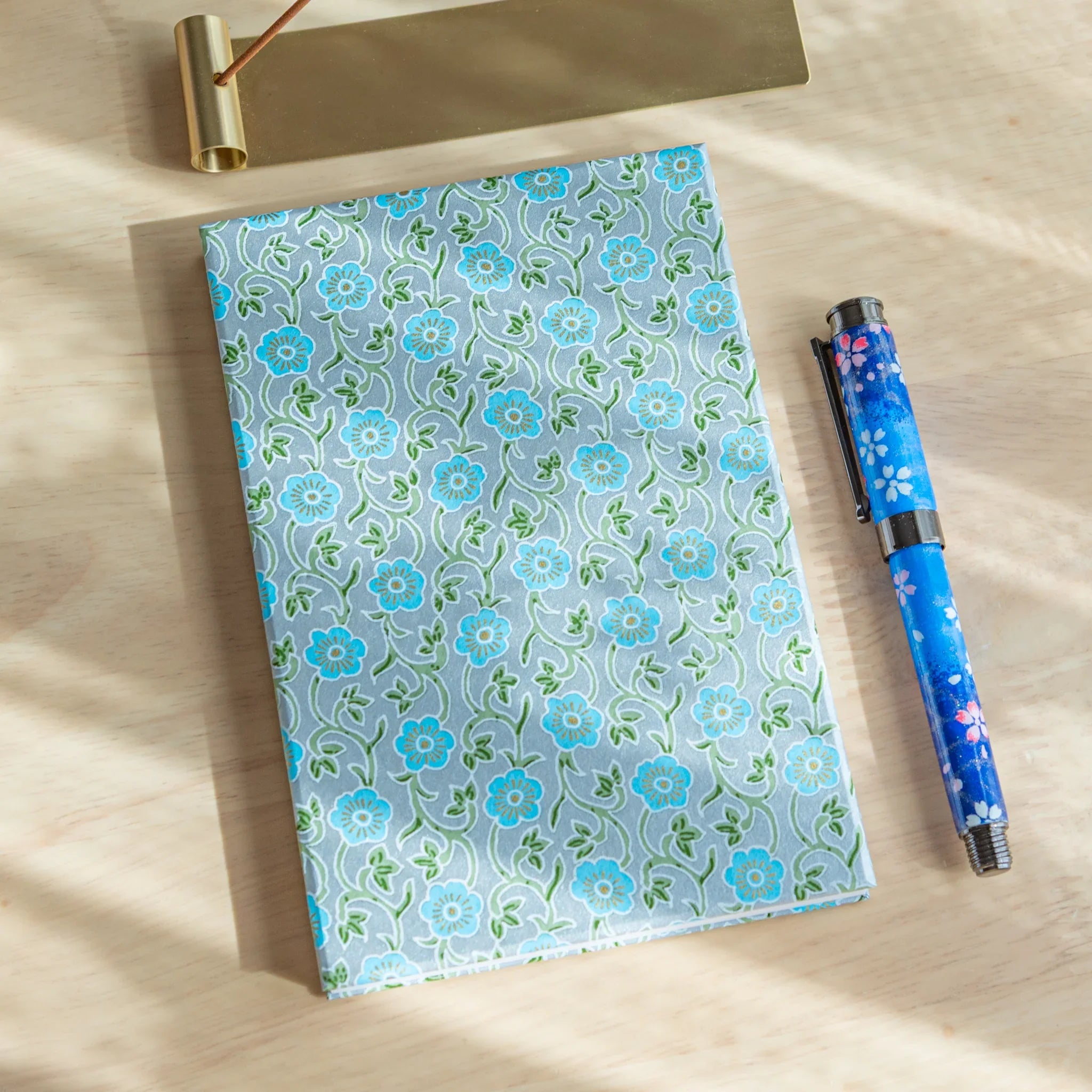 Pastel Blue Flower Washi Goshuincho Stamp Book cover with turquoise blossoms and green vines on pattern
