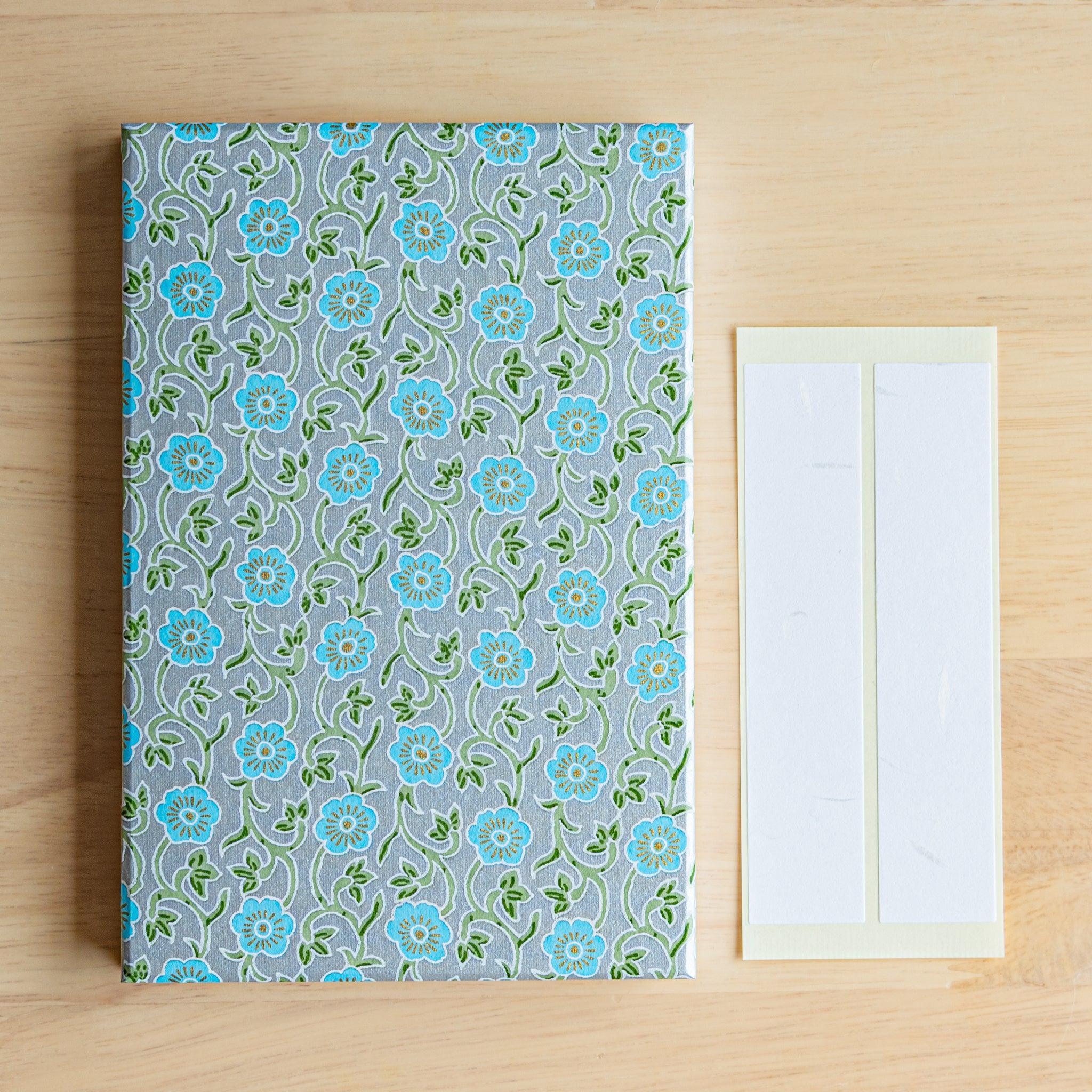 Pastel blue flower pattern Goshuinsho stamp book with included label sheets. Japanese washi stationery item.