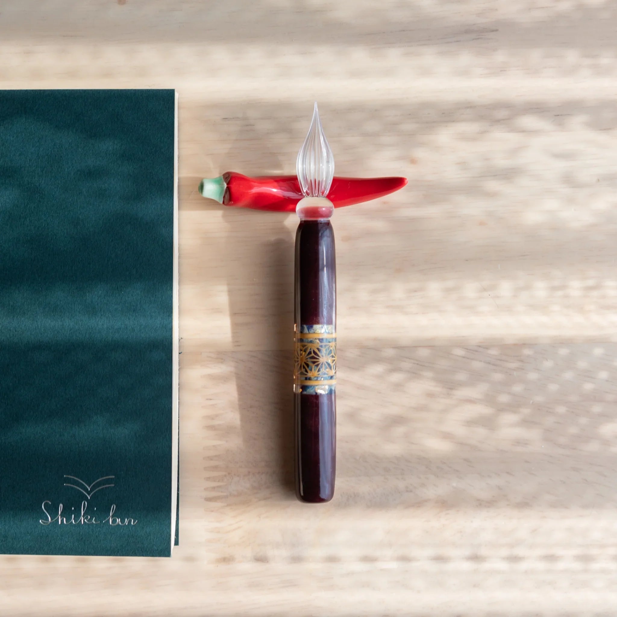 Pepper Handcrafted Pen Rest in red ceramic showing authentic pepper vegetable form with artisanal craftsmanship