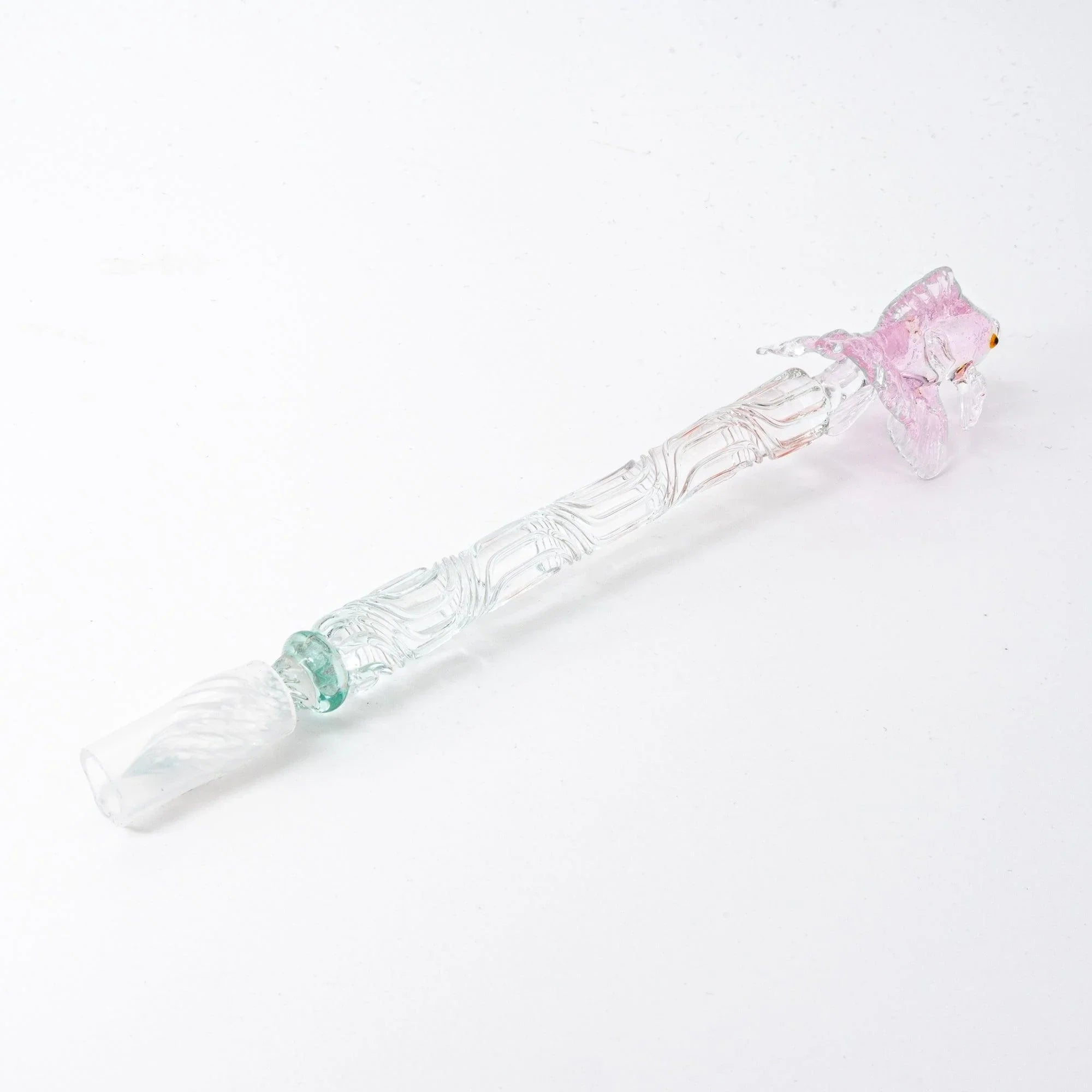 hand-made pink glass dip pen with goldfish design shown in detail highlighting ornate metal components shine
