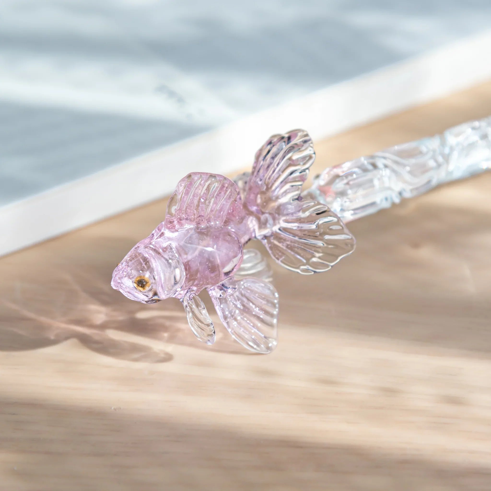 Japanese pink glass dip pen featuring goldfish motif shown in full length with ornate metal nib visible with holder