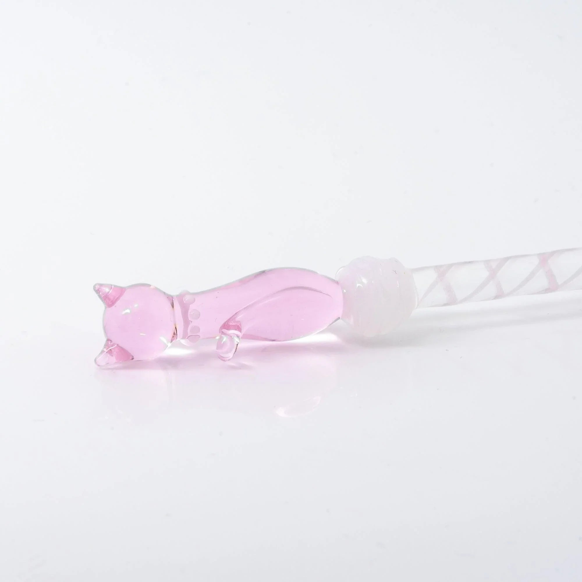 Pink Nyanko cat head molded in profile on transparent glass dip pen Japanese stationery, close-up detail