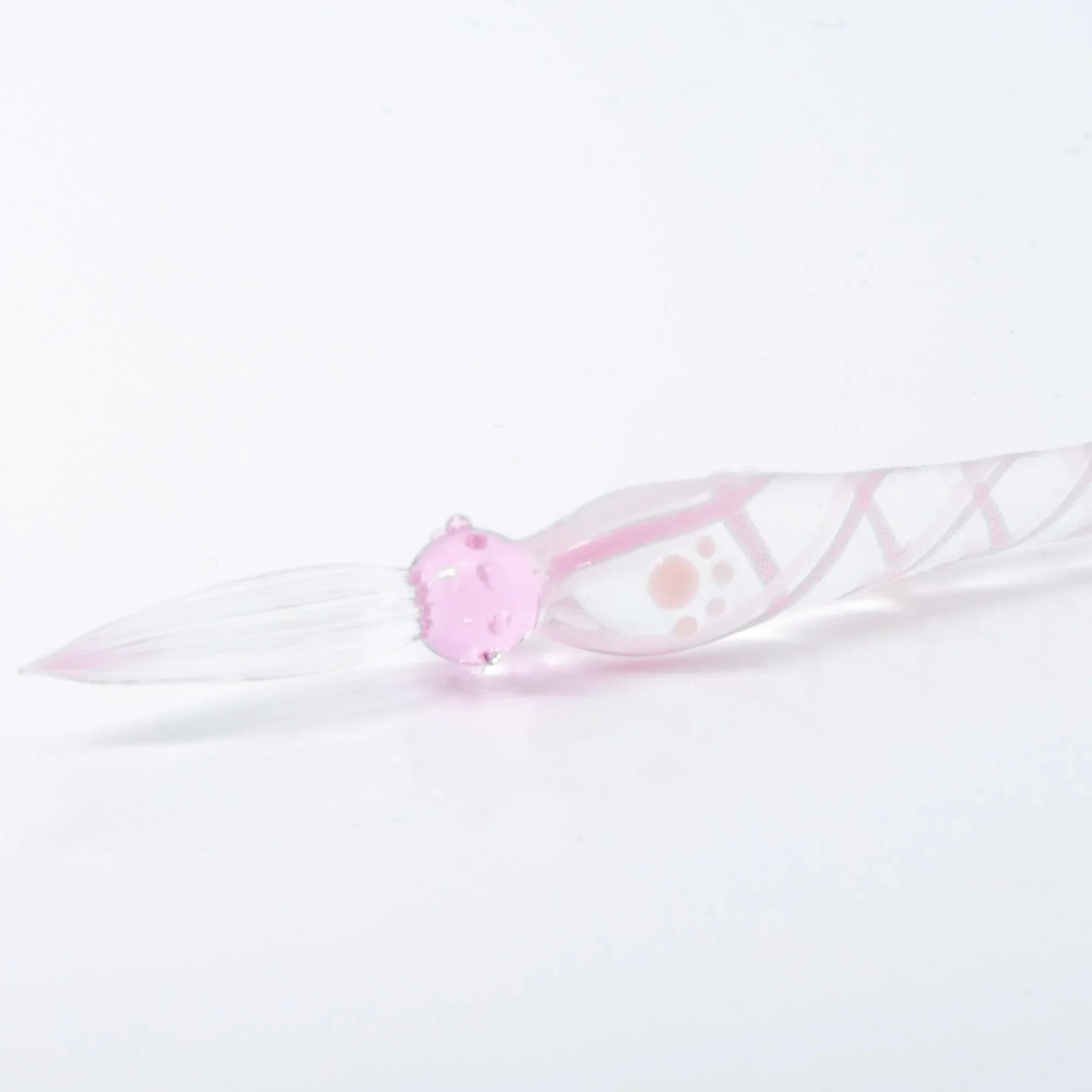 Pink Nyanko glass dip pen full view with pink sitting cat ornament at top and spiral textured barrel