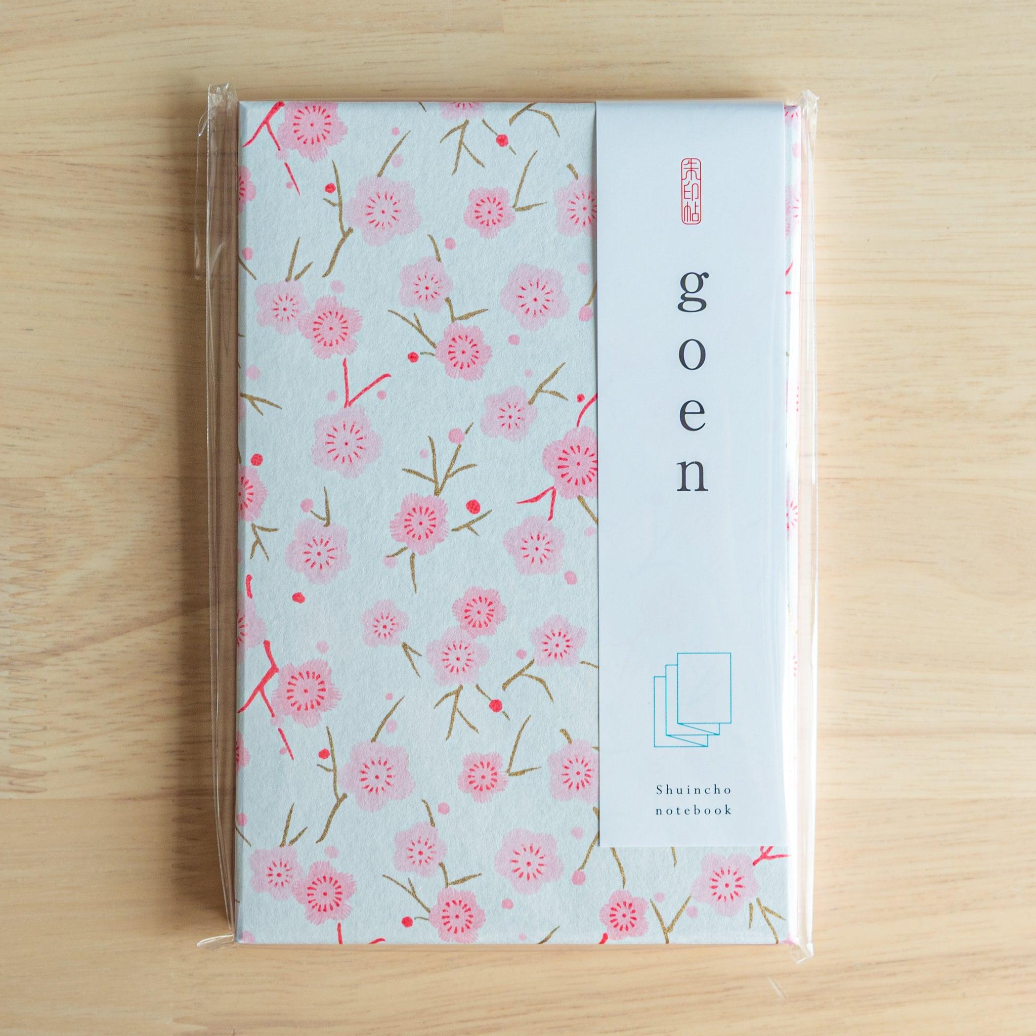 Pink plum blossom Goshuinsho stamp book in goen packaging, a charming piece of traditional Japanese stationery.