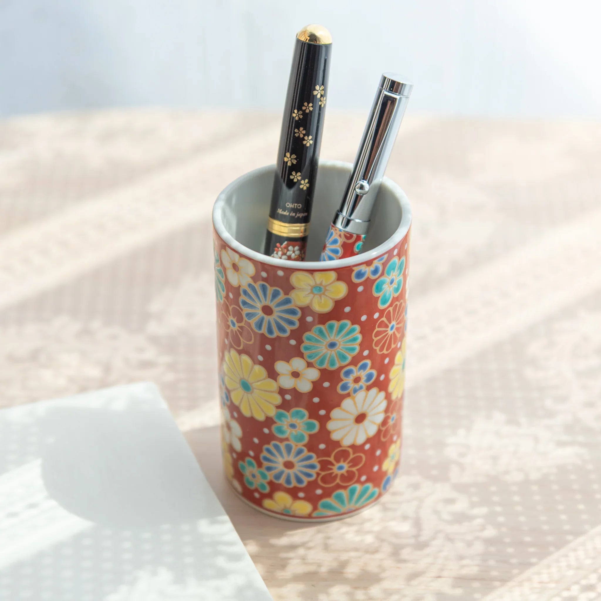 Plum and chrysanthemum Kutani ceramic pen holder featuring traditional hand-painted flower for refined desk organization