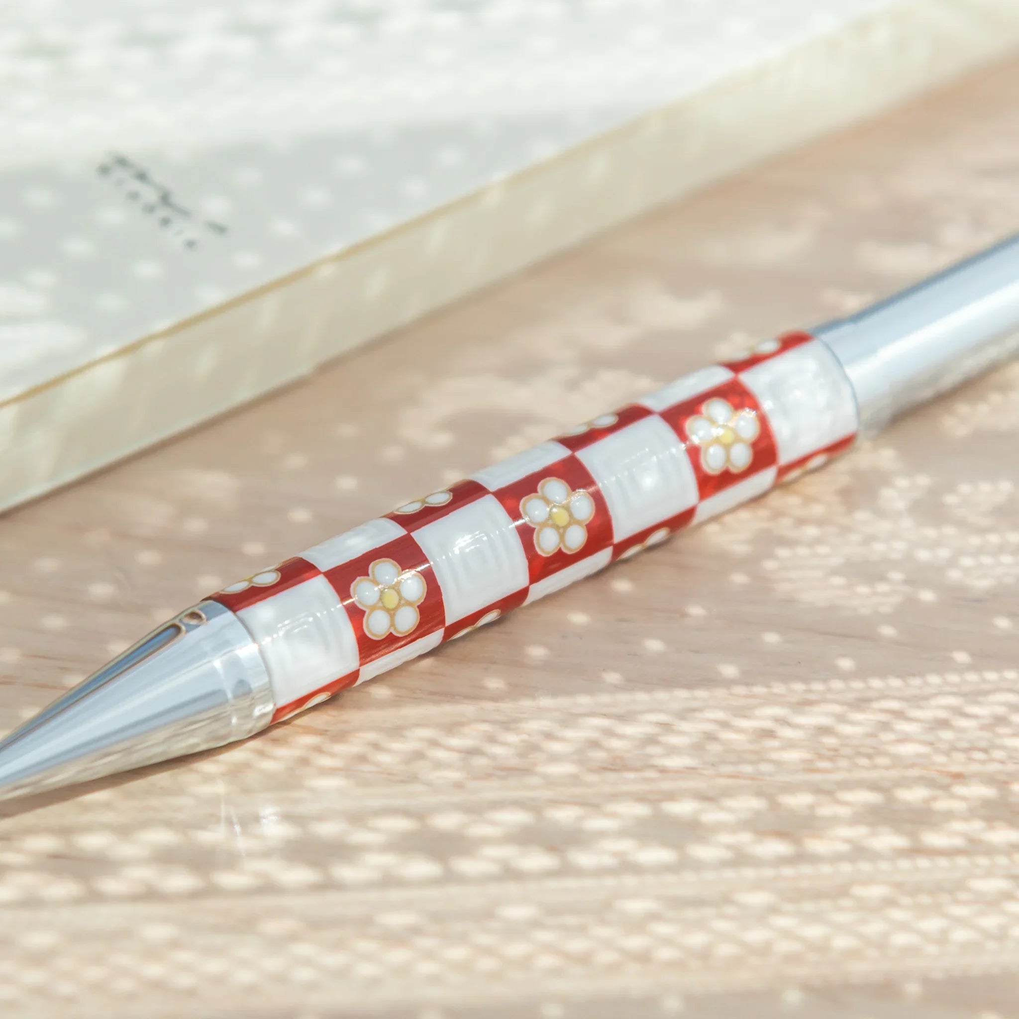 Decorative Kutani ceramic ballpoint pen with plum blossom checkered pattern for writing featuring traditional porcelain