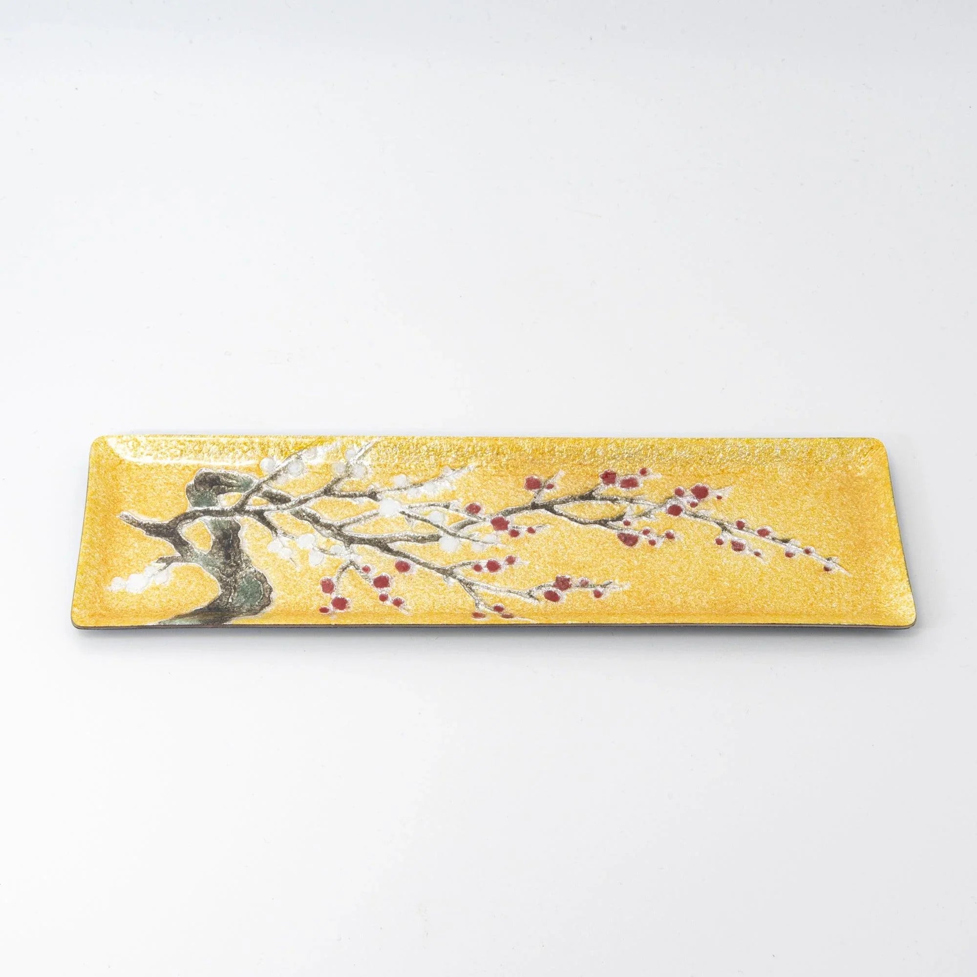 Gold enamel slim pen tray on white background, side view showing full width with plum branch and red berry design from trunk