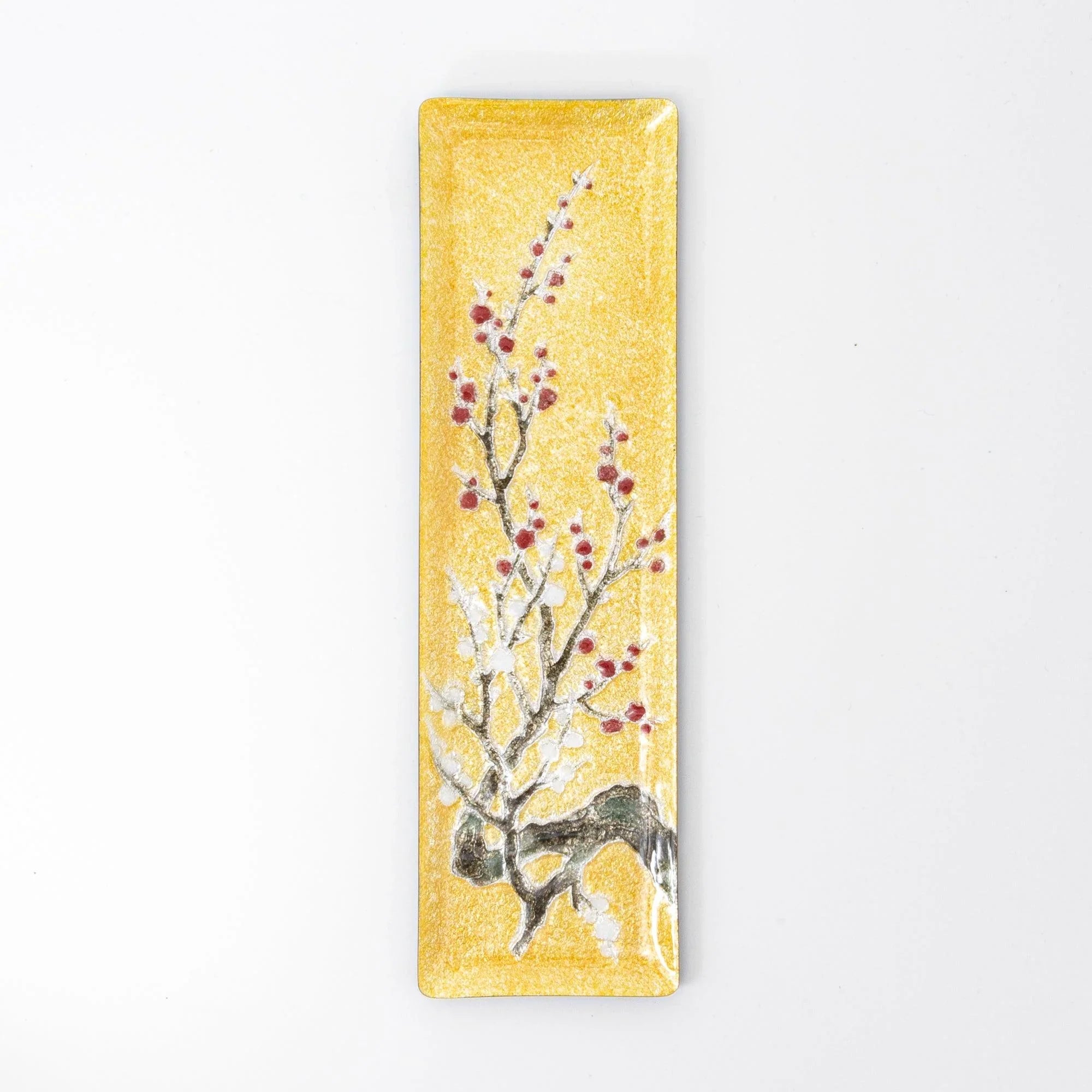 Gold enamel slim pen tray with plum branch and red berry design, front overhead view on white background