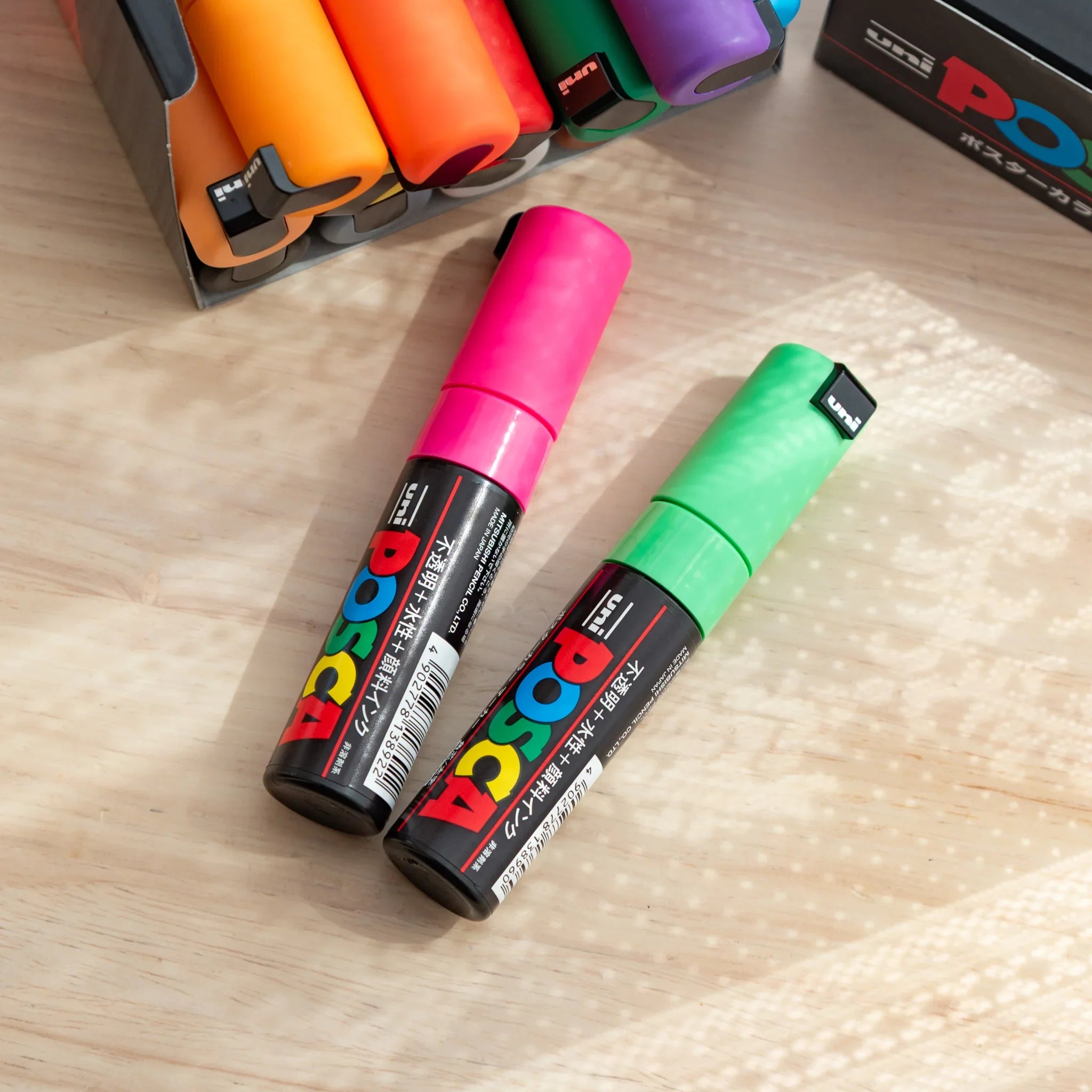 POSCA Markers Set (Bold Chisel Tip, 15 Colors) - paint marker showing in-use demonstration with writing on paper surface