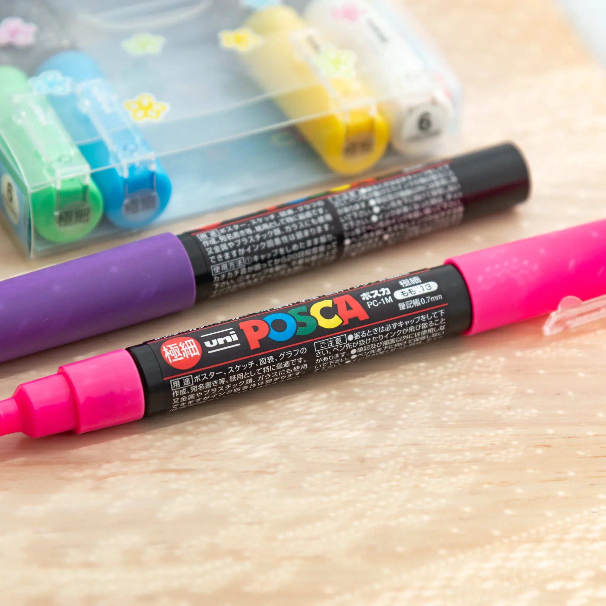 POSCA Markers Set (Extra Fine Tip, 6 Colors) - paint marker showing in-use demonstration with writing on paper surface