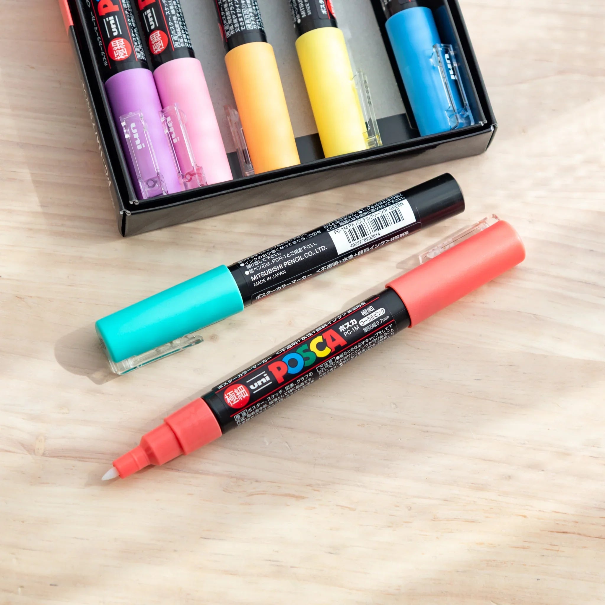 POSCA Markers Set (Extra Fine Tip, 7 Colors) - paint marker showing in-use demonstration with writing on paper surface