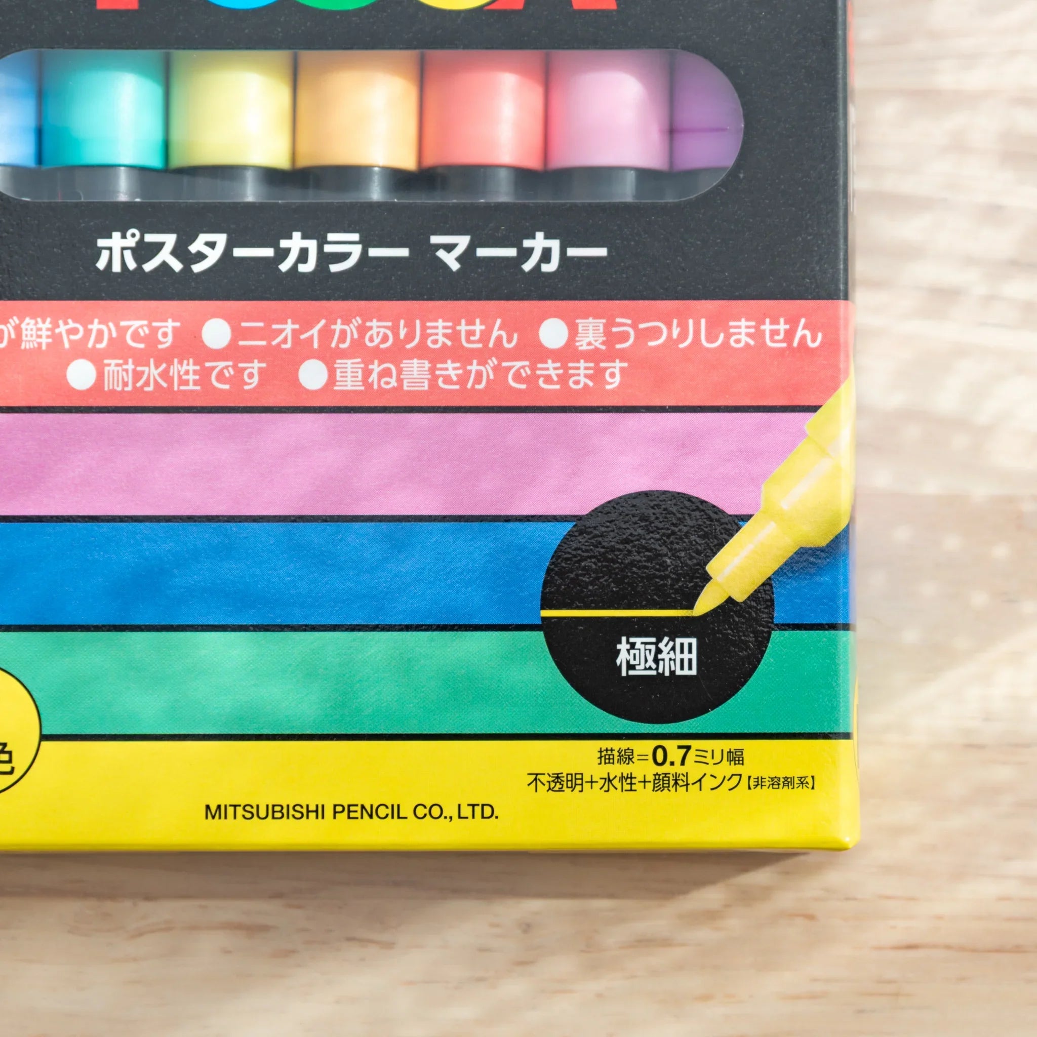 POSCA extra-fine tip marker box close-up showing Japanese specs, 0.7mm tip, color swatches, and Mitsubishi Pencil label