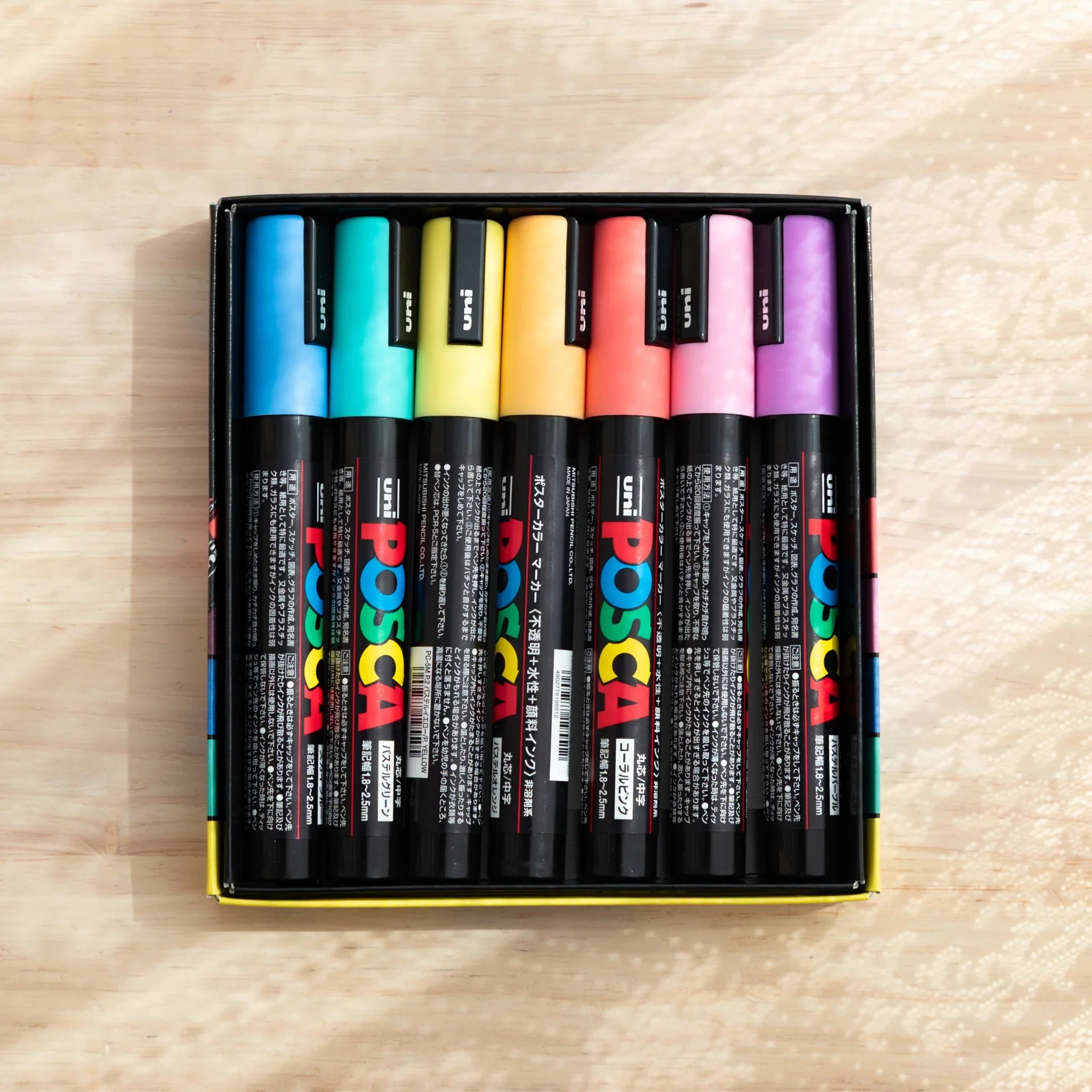 POSCA Markers Set (Medium Bullet Tip, 7 Colors) - paint marker showing side angle showing product depth and construction