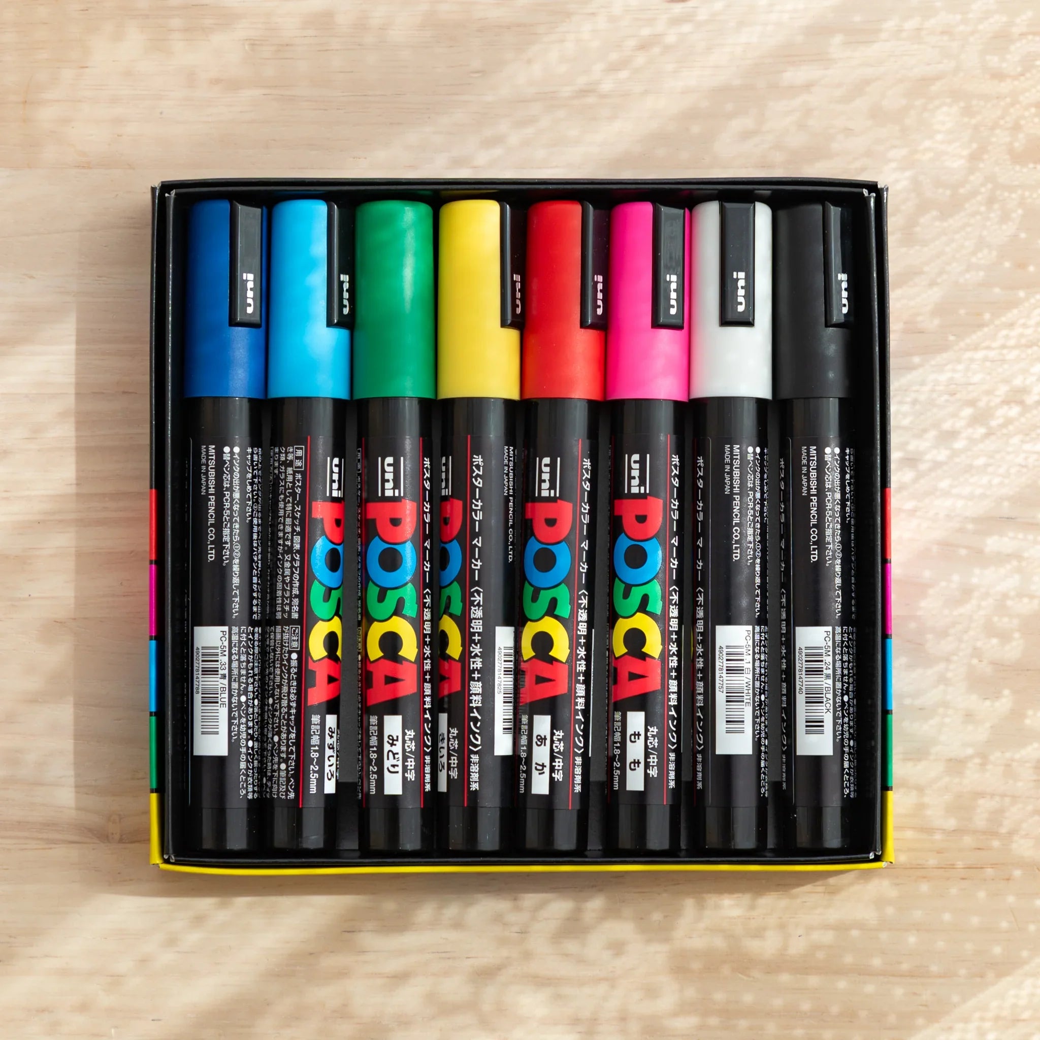 POSCA Markers Set (Medium Bullet Tip, 8 Colors) - paint marker showing side angle showing product depth and construction