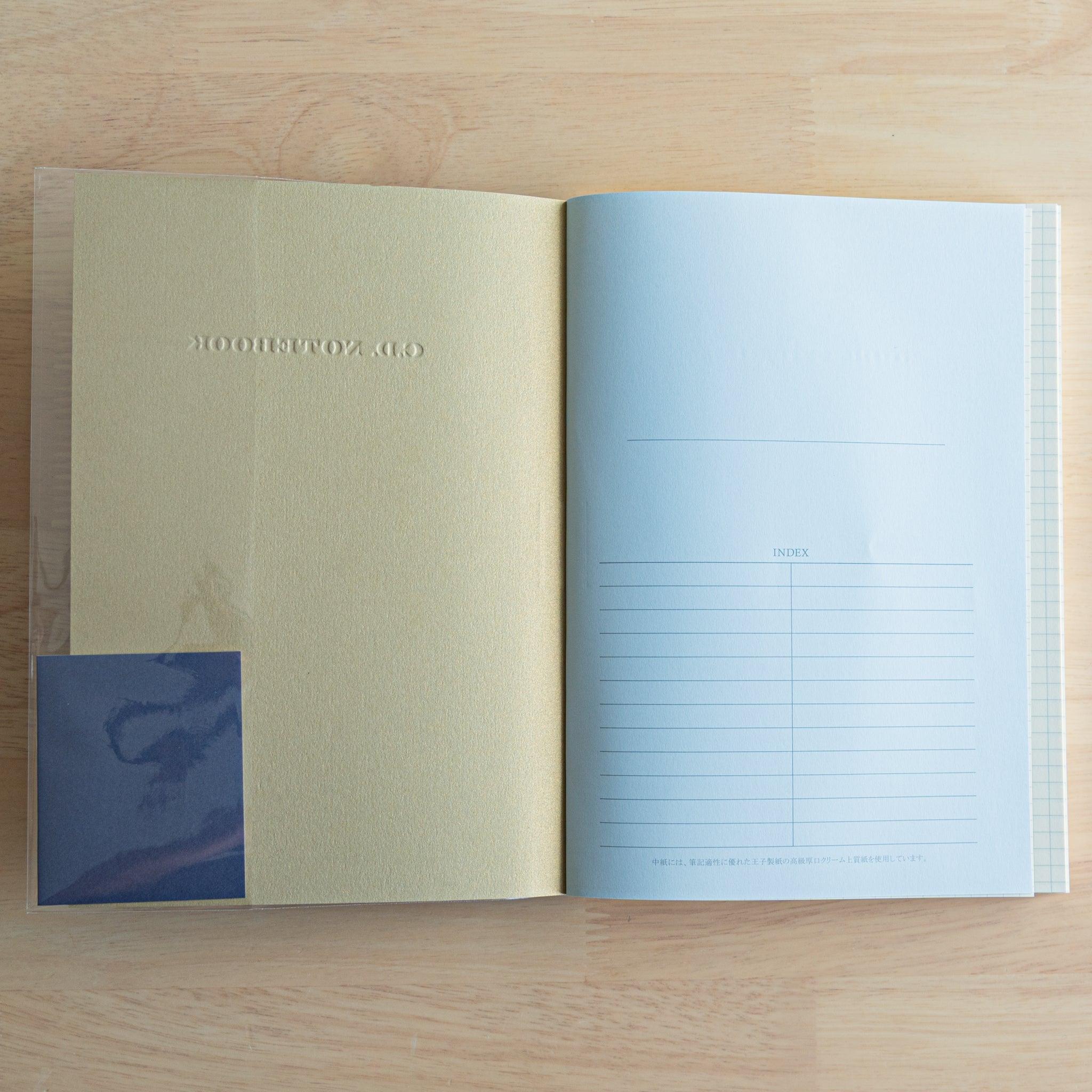 Interior view of a Premium C.D. Japanese notebook showing gold inside cover and index page on fountain pen-friendly paper