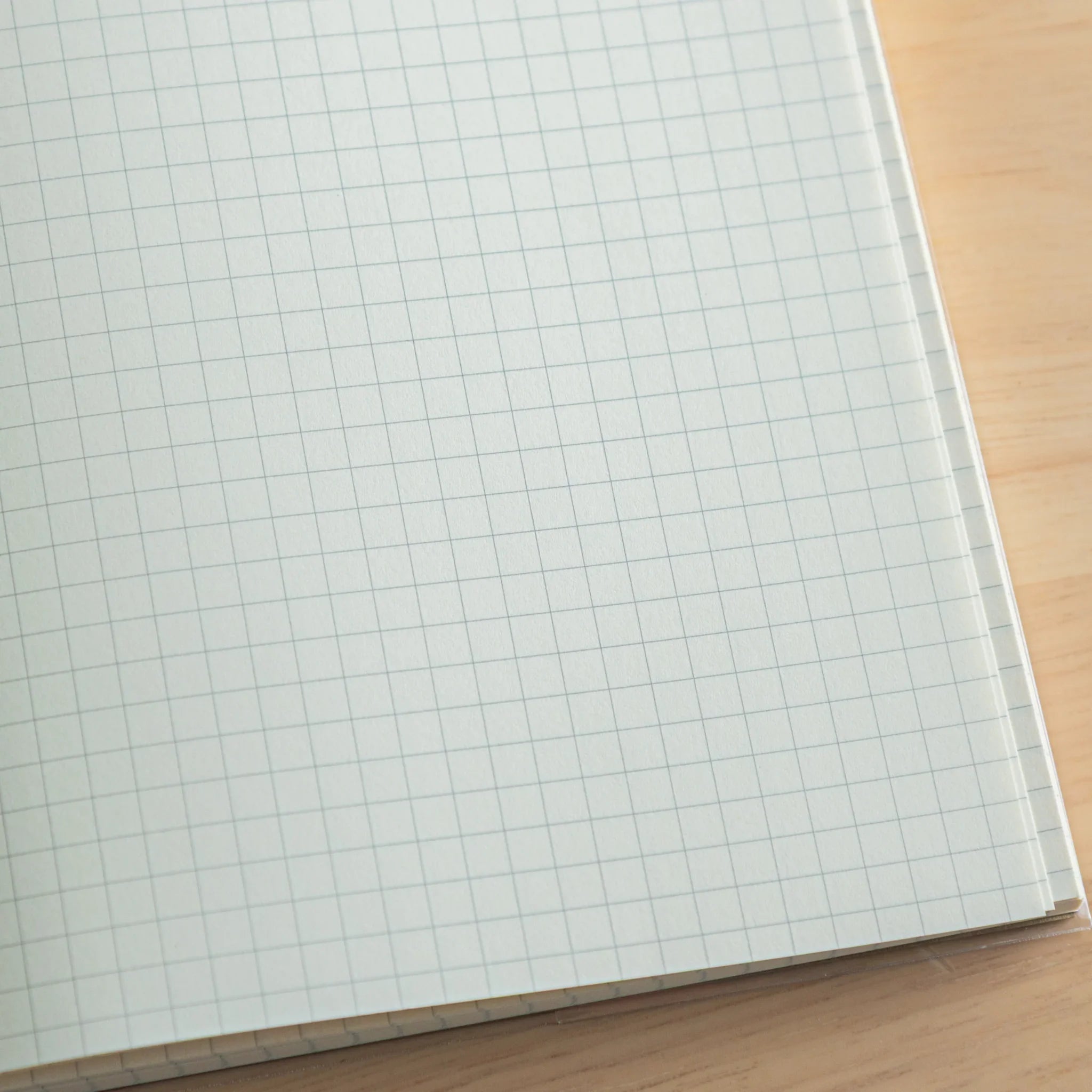 Premium CD A5 fountain pen notebook cream colored with interior spread showing light blue lined pages and index area