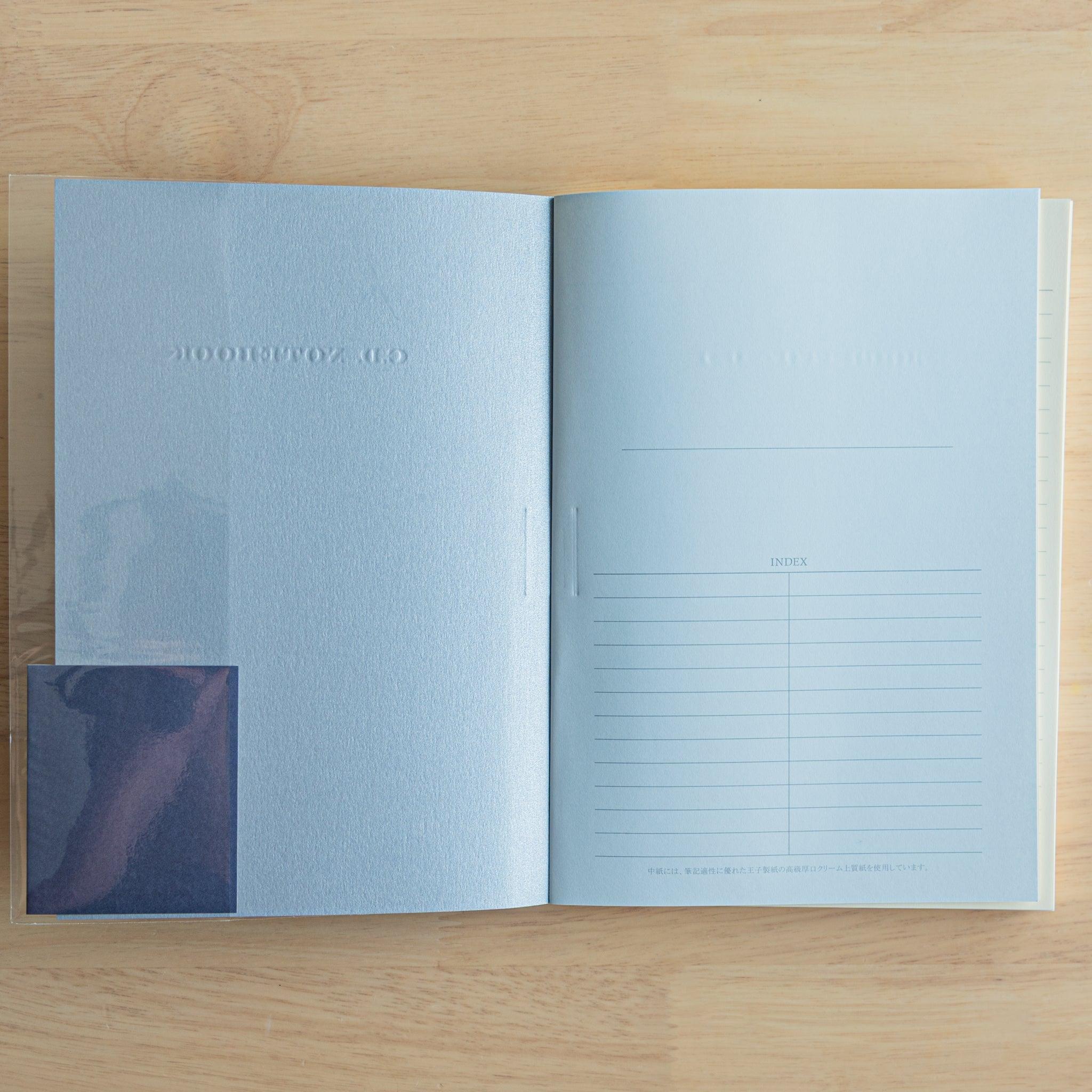 Inside view of a blue Premium C.D. Japanese notebook showing embossed cover and index page, designed for fountain pen writing