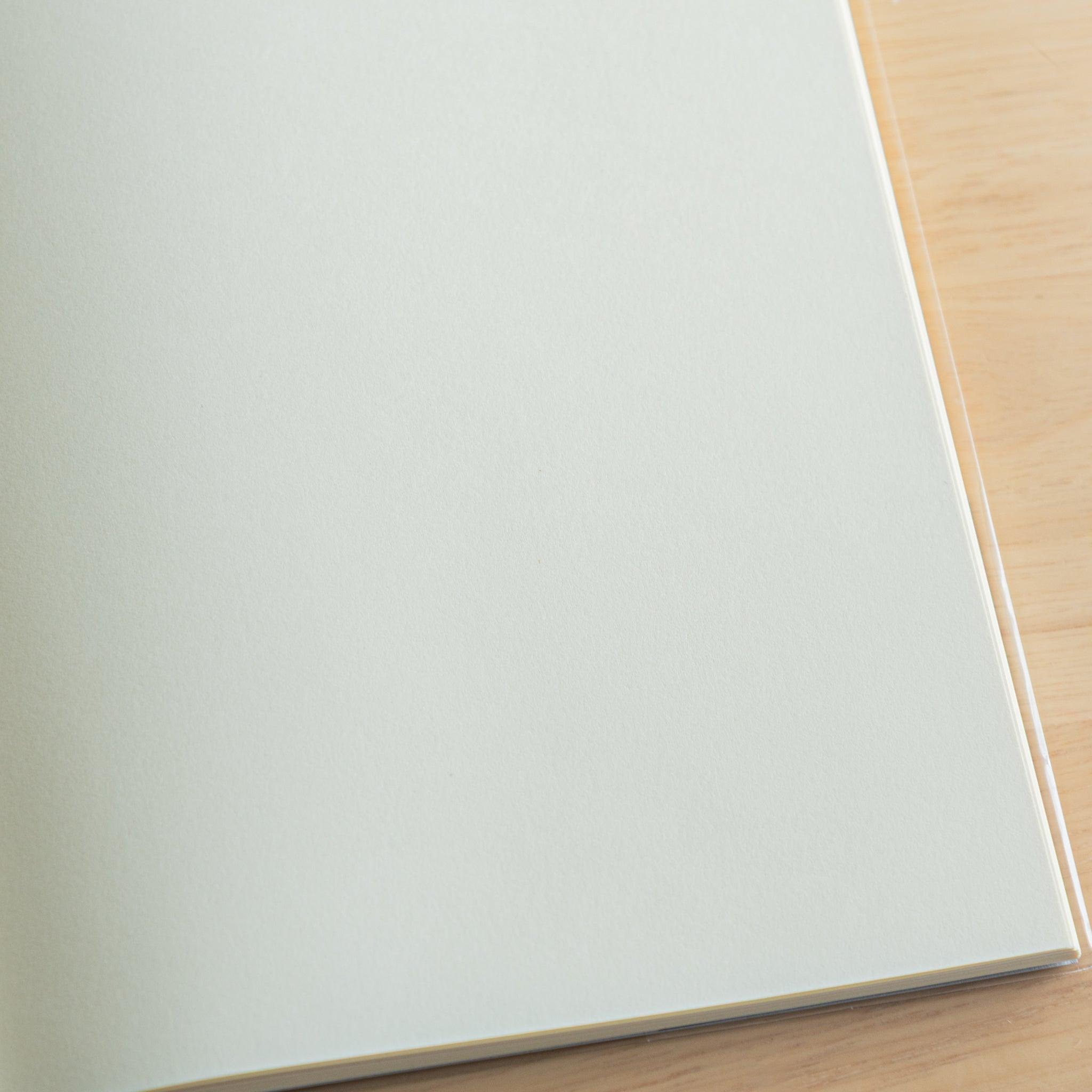 Close-up of a single blank page in a Japanese notebook, showcasing its smooth cream paper made for fountain pen writing