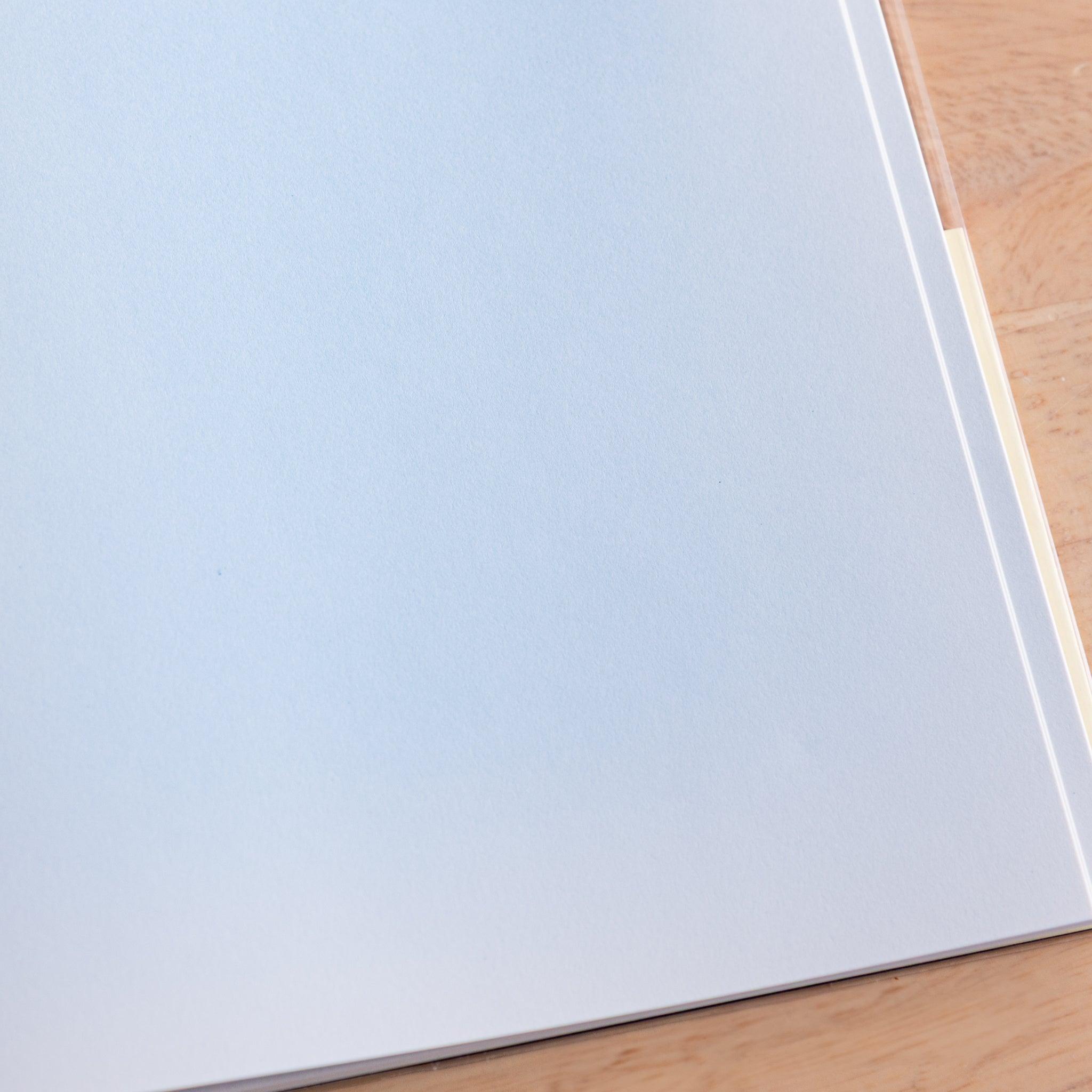 Close-up of plain white page in a Premium CD Japanese notebook, featuring smooth texture for fountain pen writing.