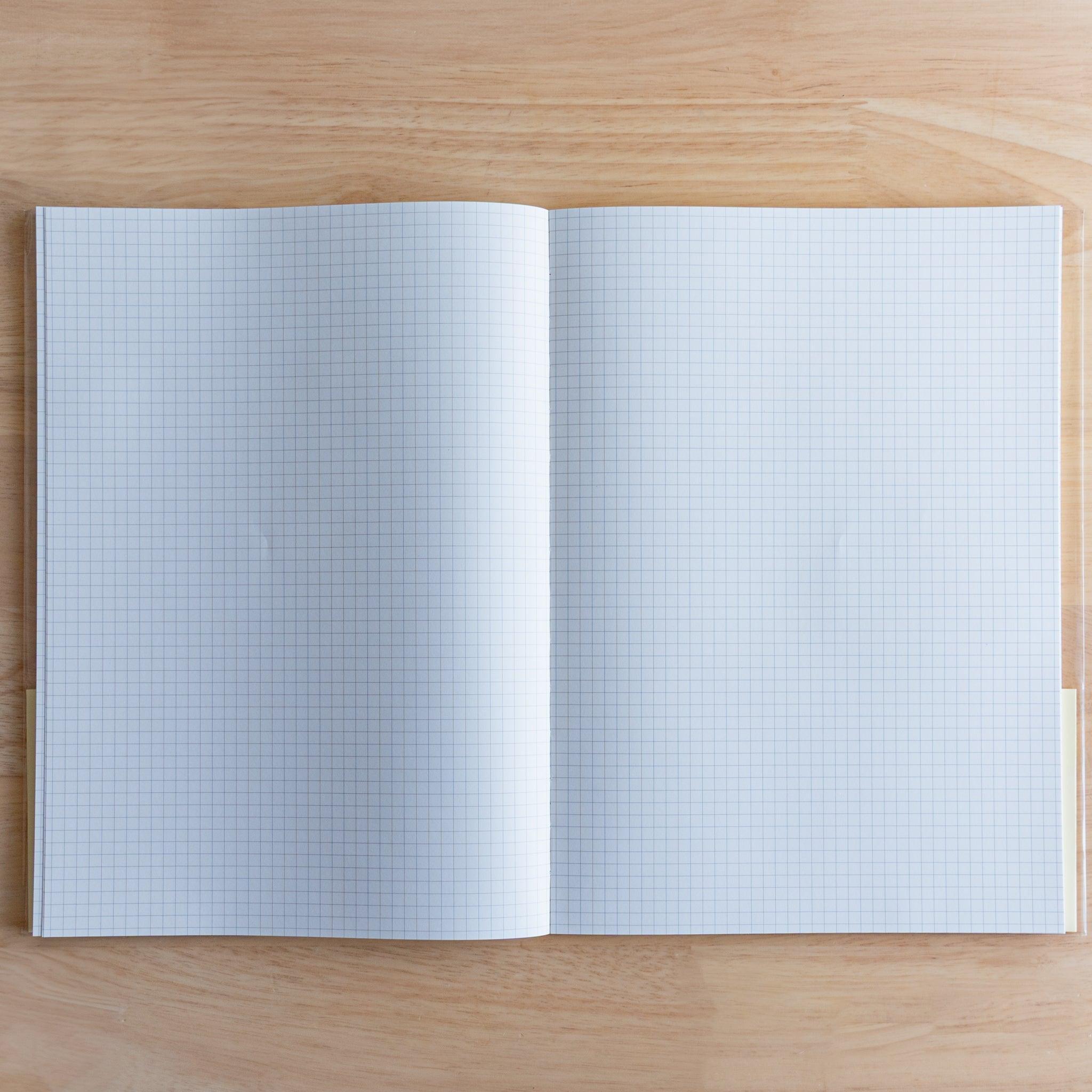 Open Premium C.D. Japanese notebook showing two grid white pages, made for smooth writing with fountain pens.