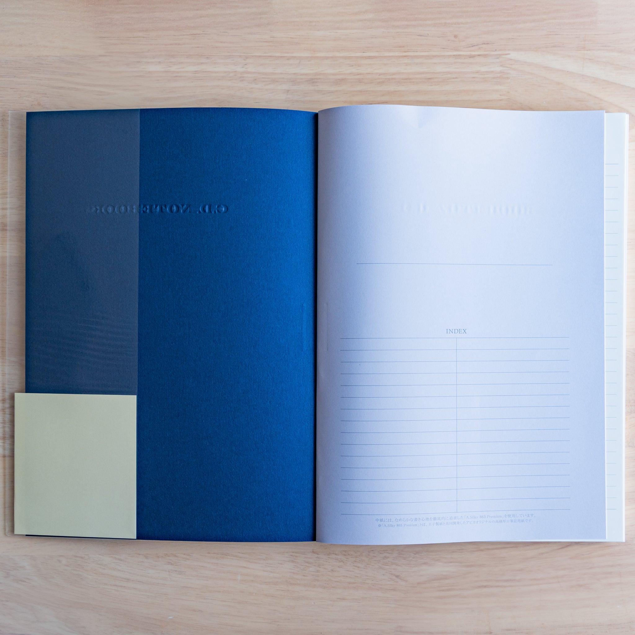 Inside view of a blue Premium CD Japanese notebook showing textured inner cover and index page.