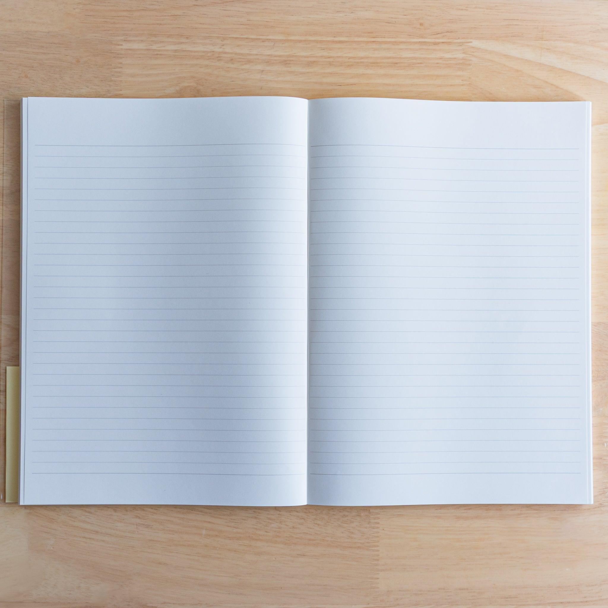 Open Premium C.D. Japanese notebook showing two lined white pages, made for smooth writing with fountain pens.
