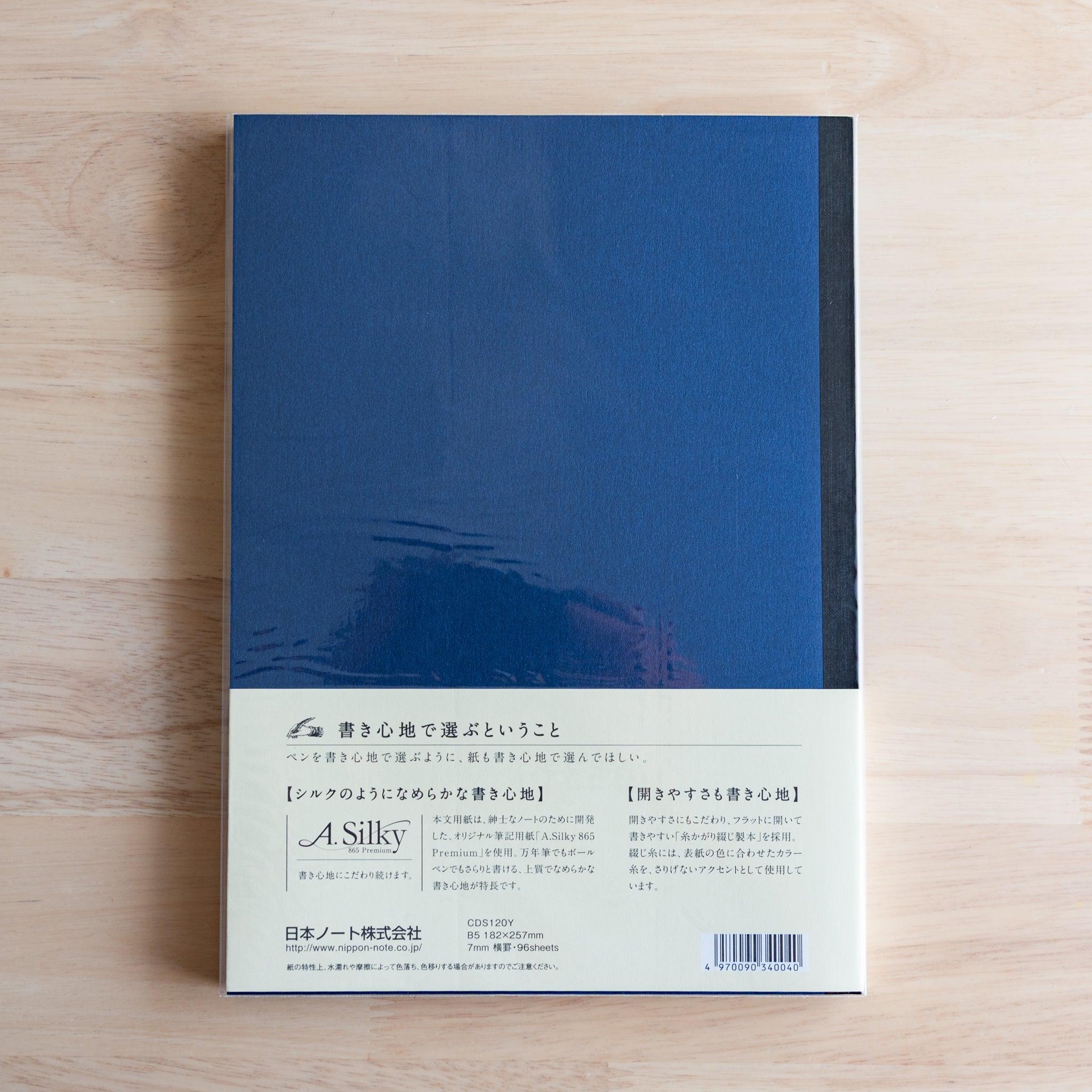 Back of blue Premium C.D. Japanese notebook with cream label explaining A.Silky 865 Premium paper.