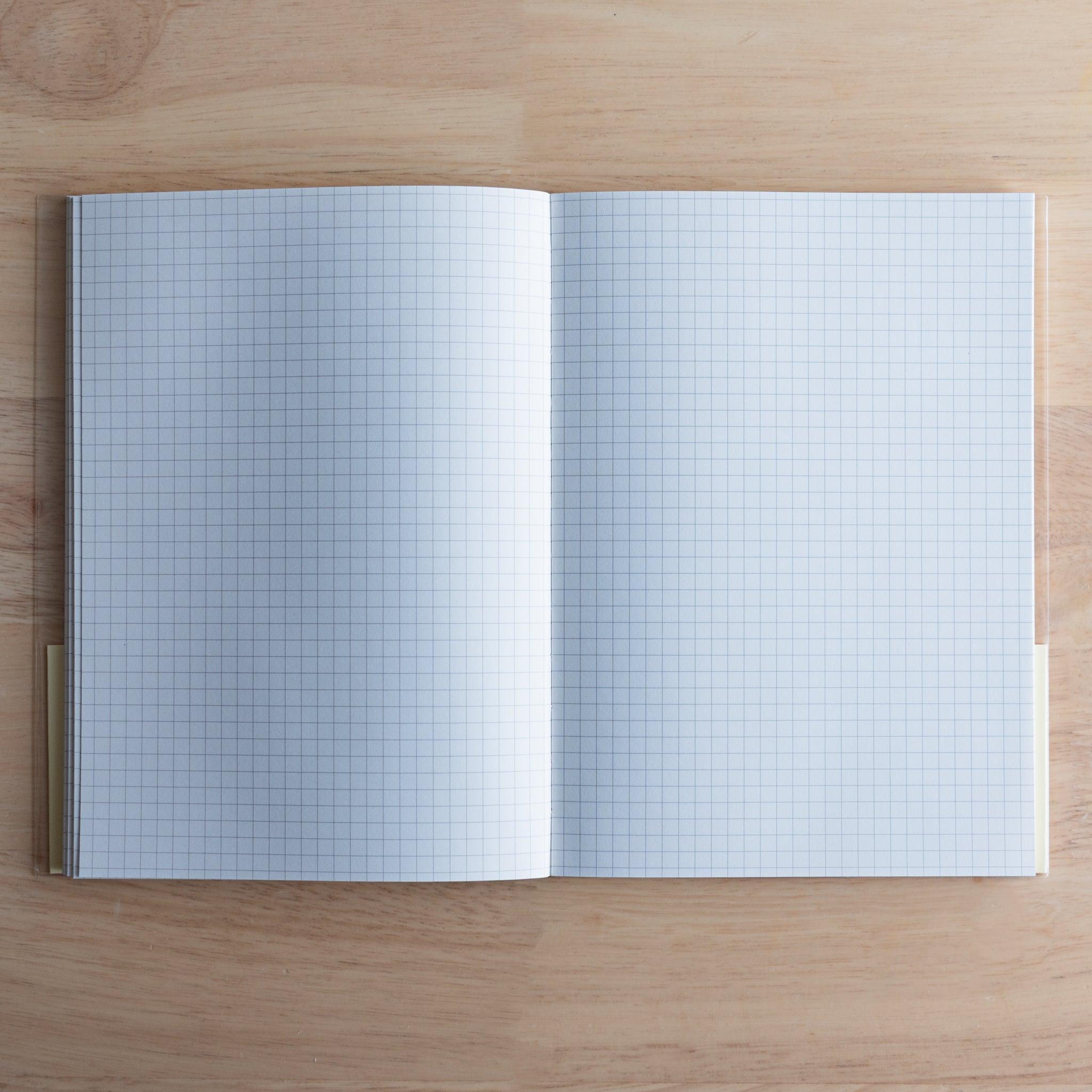 Open Premium C.D. Japanese notebook showing two grid white pages, made for smooth writing with fountain pens.