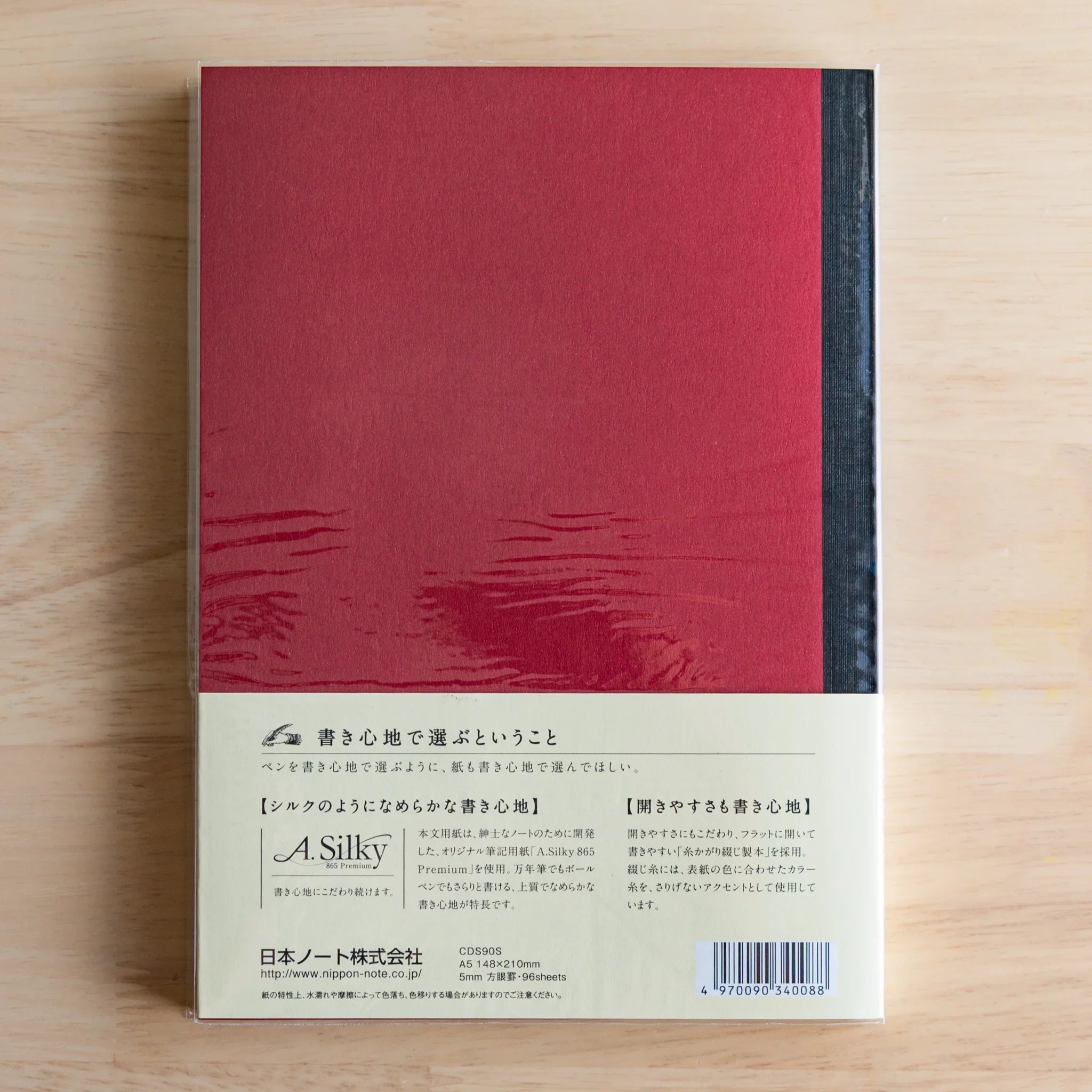 Apica Premium CD Fountain Pen Notebook Silky single book standing product shot on wooden table Japanese premium