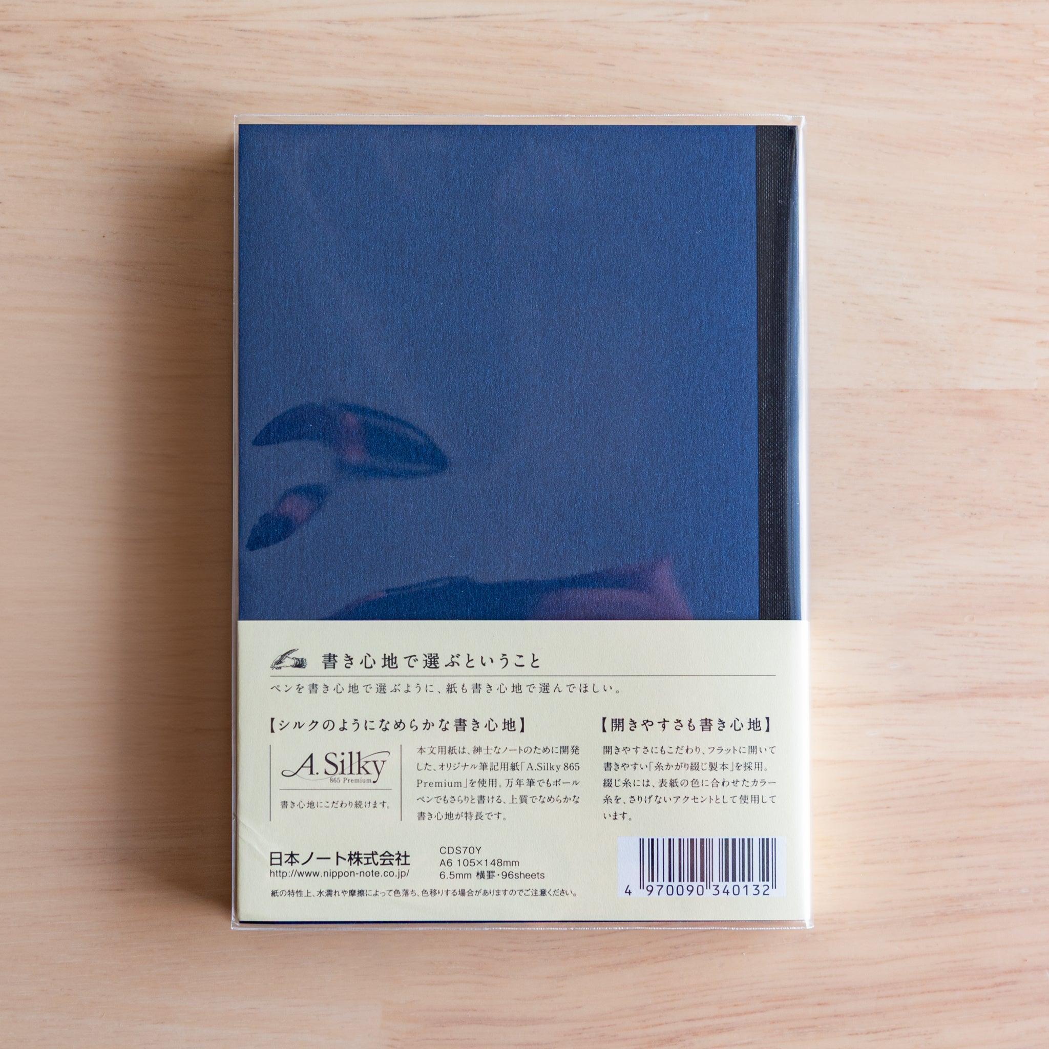 Back of blue Premium C.D. Japanese notebook with cream label explaining A.Silky 865 Premium paper.