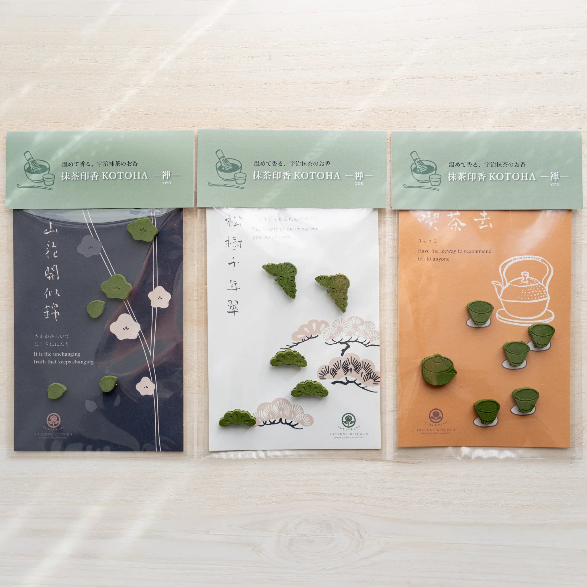 Three INCENSE KITCHEN pressed matcha incense refill cards, plum on dark navy, pine on white, and tea on orange, side by side