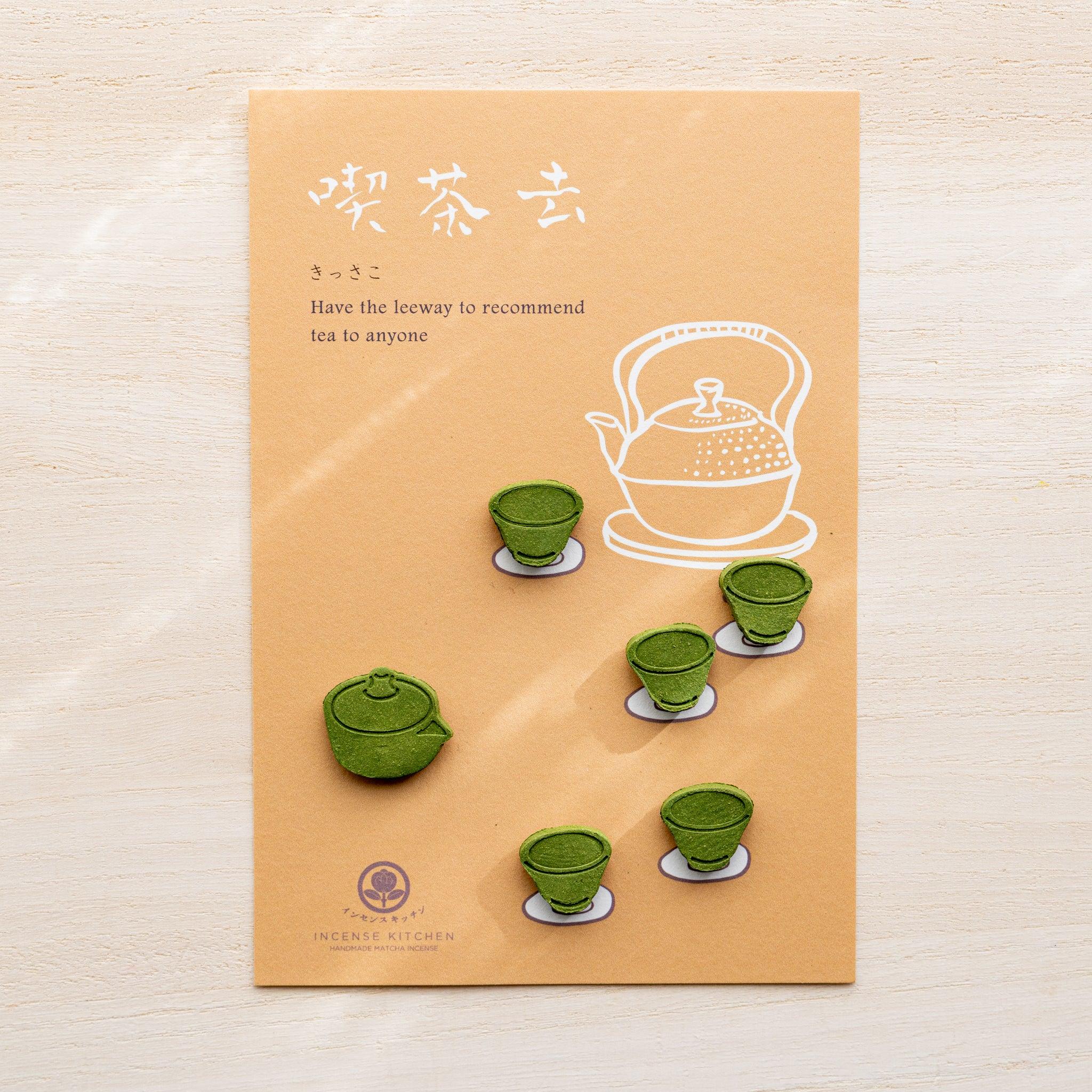 Tea variant pressed matcha incense card, orange with white teapot illustration and small green teapot and tea cup pieces