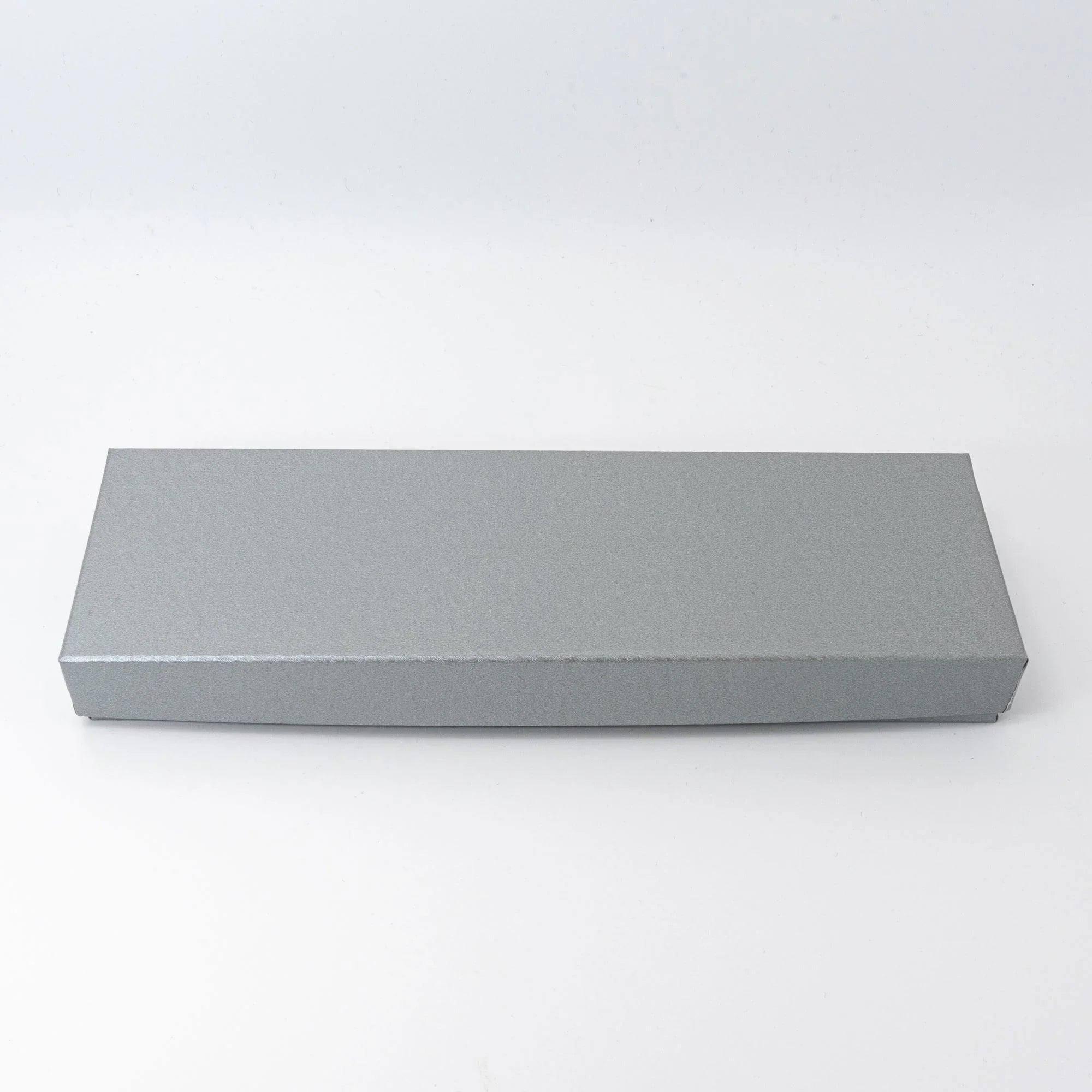 Rectangular silver gray matte cardboard gift box with lift-off lid for slim pen tray, on white background